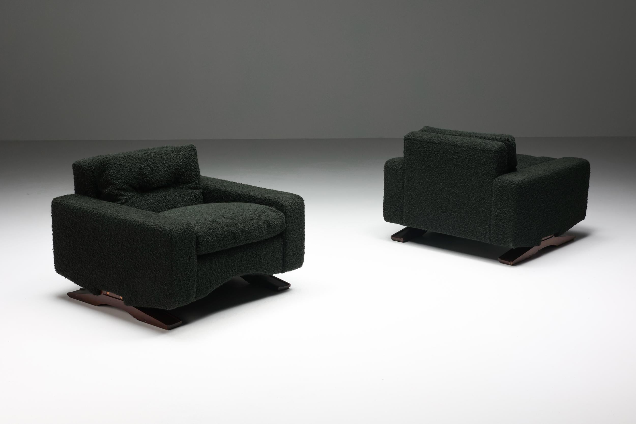 Franz Sartori for Flexform, pair of lounge chairs, boucle, wood, Italy, 1960s

Sturdy pair of lounge chairs in dark green boucle by the Italian sculptor Franz Sartori. These chairs feature a modern design due to the straight lines. The waved