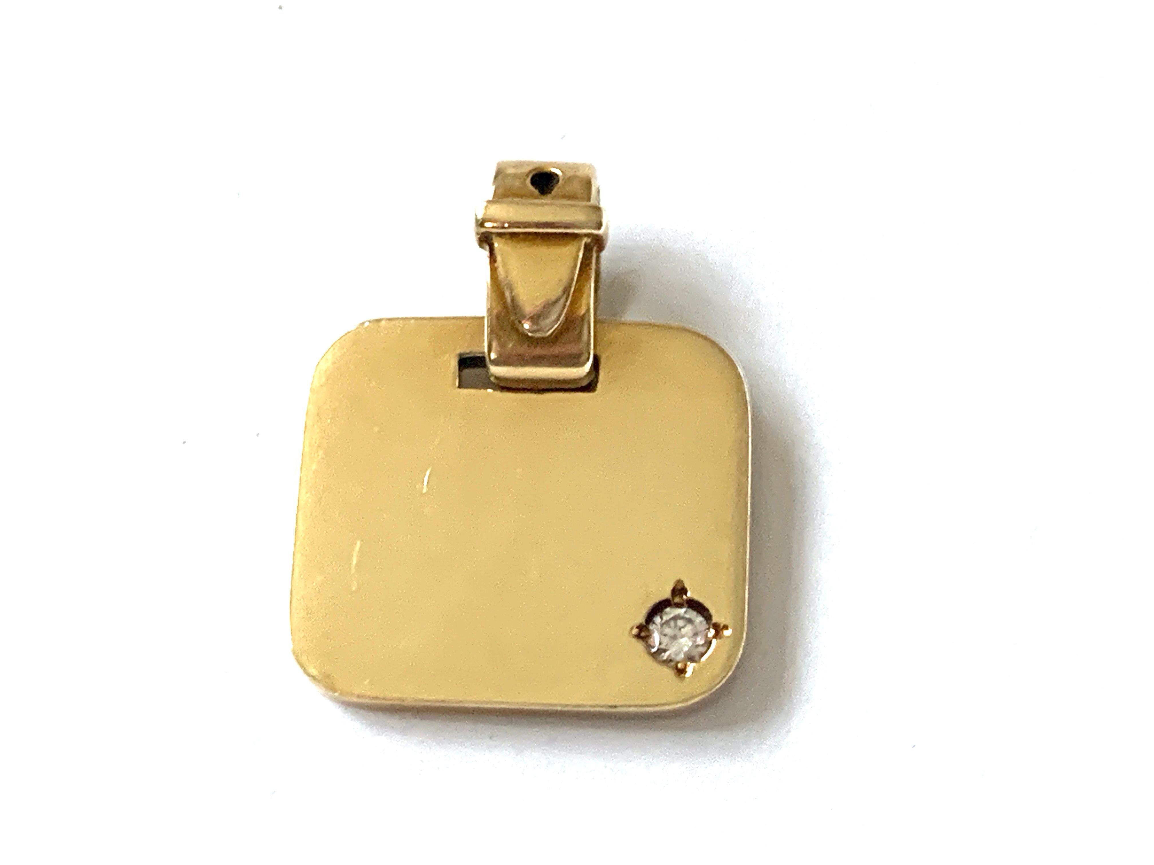 14ct Gold Diamond Buckle Bail Tag Pendant 
Designed by German Designer Franz Scheuerle
Era 1960s - 1970s
Beautiful quality lively 0.10 Carat diamond solitaire 
Solid Piece of Jewellery 
Stamped 585  makers FS in an Oval 
