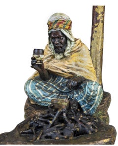 Arab warrior resting at the base of a palm tree