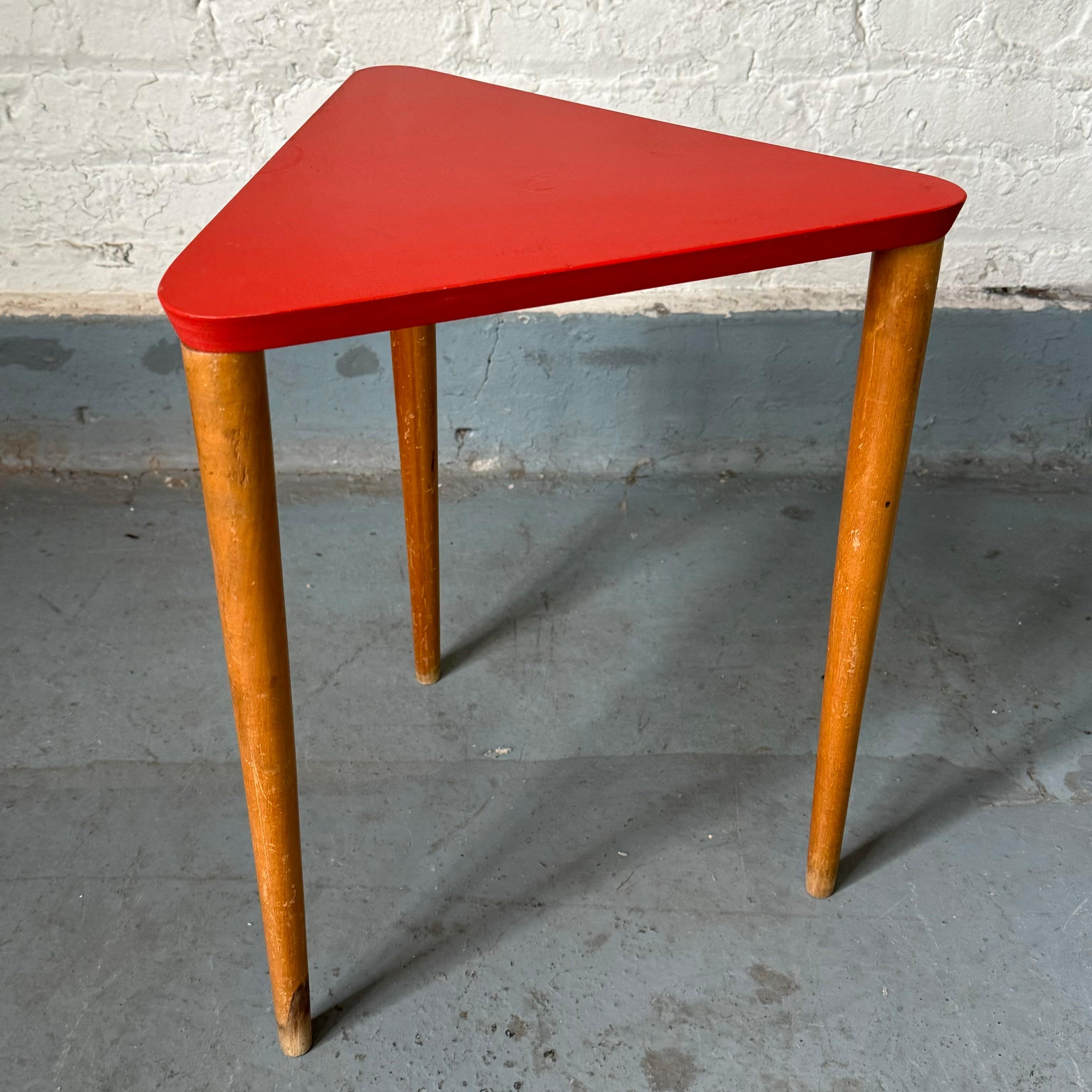 Stacking side table (or stool) with a triangular lacquered plywood top and solid birch dowel legs. Designed by Boston area designer and urban planner Fran Hosken and produced by her eponymous company Hosken, Inc between 1947-1951. Fran’s engineer