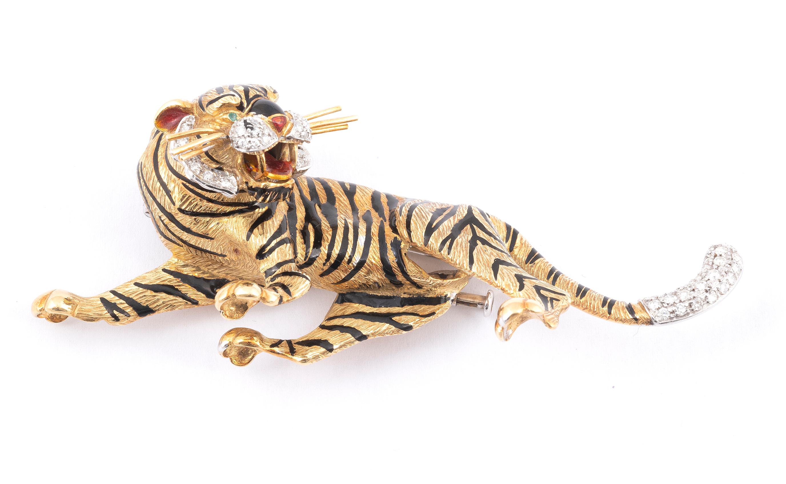 Brooch designed as a tiger, applied with enamel, set with single-cut diamonds and circular-cut ruby eyes.
Weight: 46,3gr.
Lenght: 89mm



