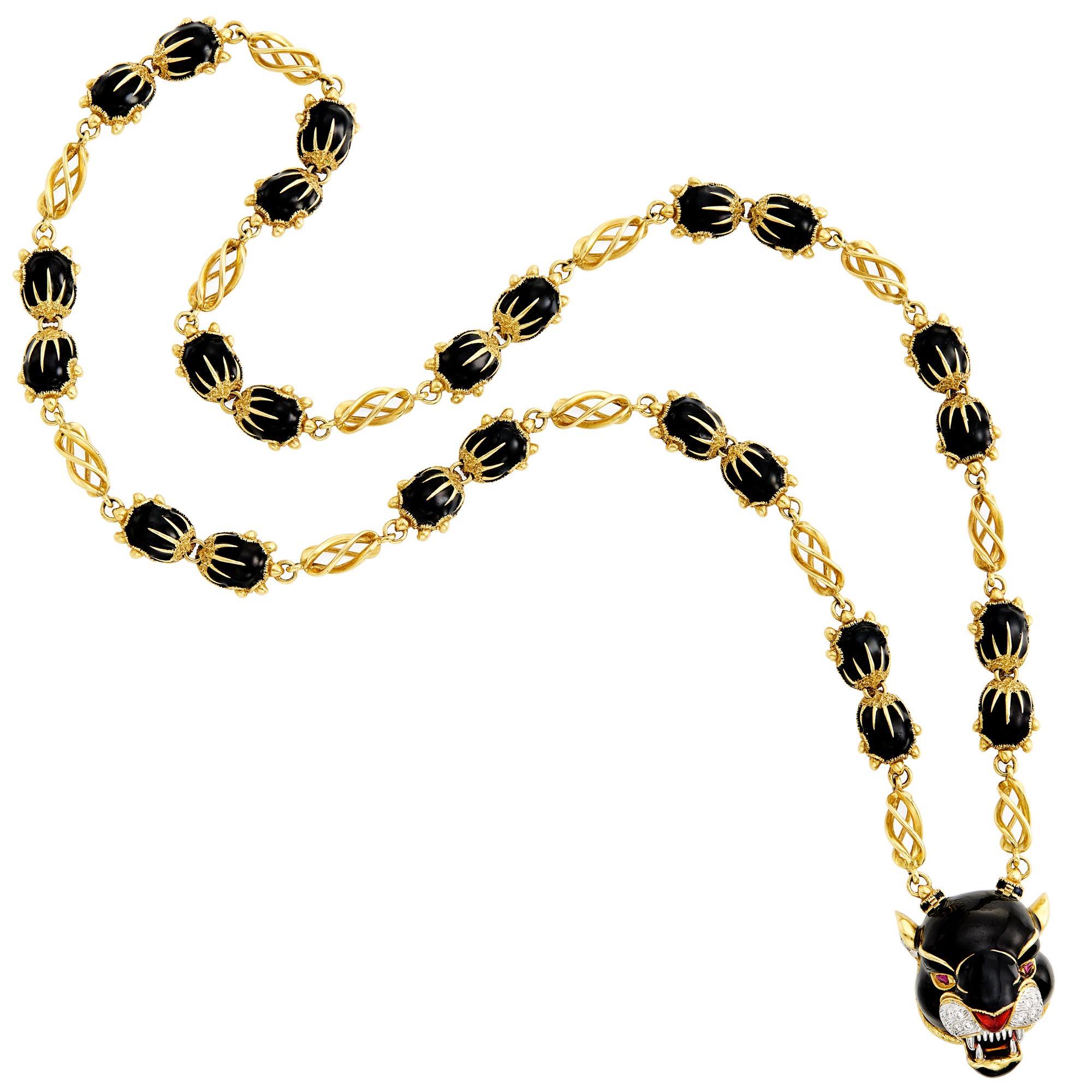 A fierce Frascarolo panther pendant sautoir in 18kt yellow gold with diamonds and black and red enamel, signed, with maker’s mark, approximately 133grs. Italy, circa 1970s.