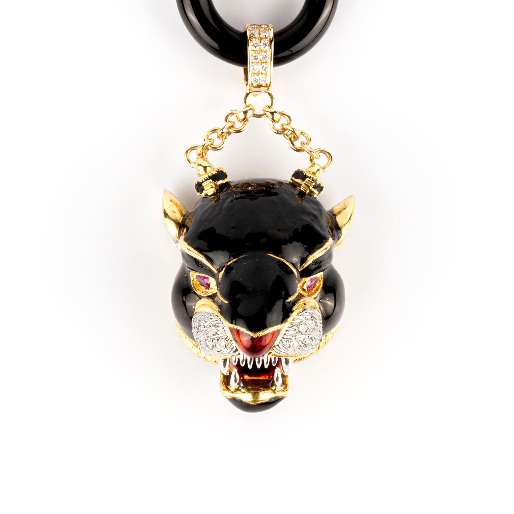 Frascarolo Jaguar Pendant and Brooch in black enamel on 18k gold, with lapis lazuli and diamond details, further embellished by ruby eyes with a red enamel nose and mouth with white gold fangs.  Made in Italy, circa 1960.