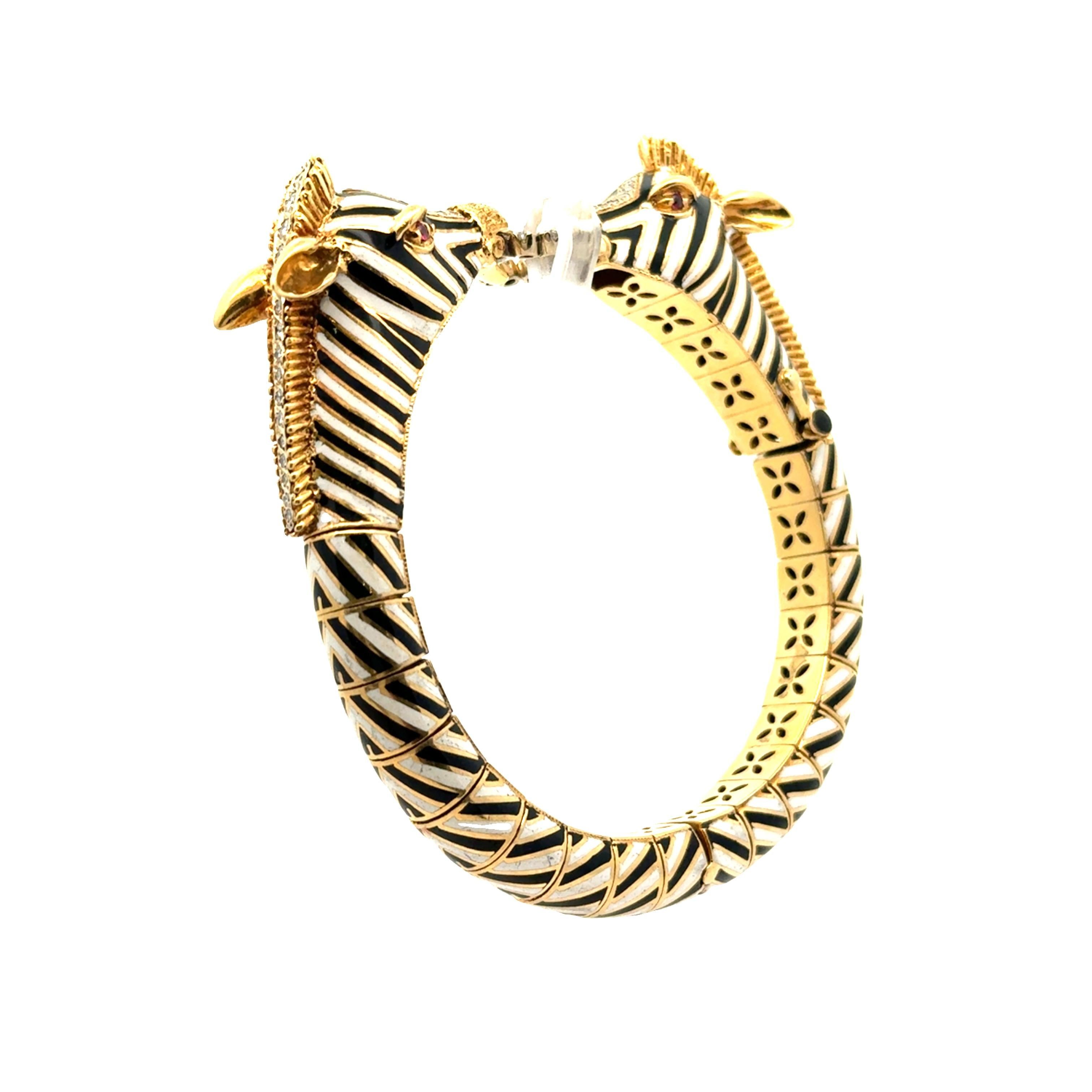 A striking modern bracelet by Italian designer Frascarolo, featuring an intricate zebra motif. The bracelet is crafted in 18k yellow gold and adorned with black and white enamel, creating a bold contrast. The design is accentuated by round white