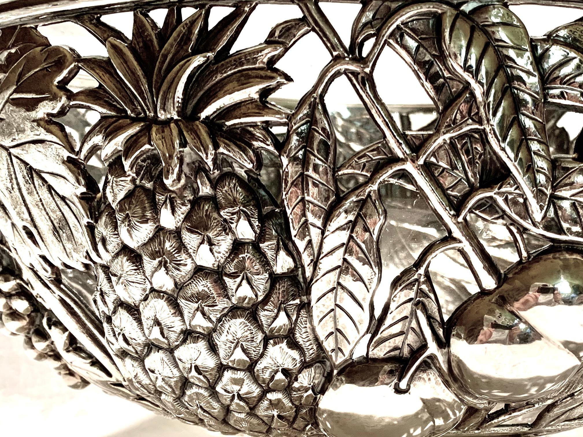 Magnificent reticulated Italian sterling silver centerpiece by the renown Fratelli Cacchione Silversmiths. 
This spectacular centerpiece measures 15 inches in diameter, depicting a vast array of luscious grapes, peaches, pomegranate, oranges,