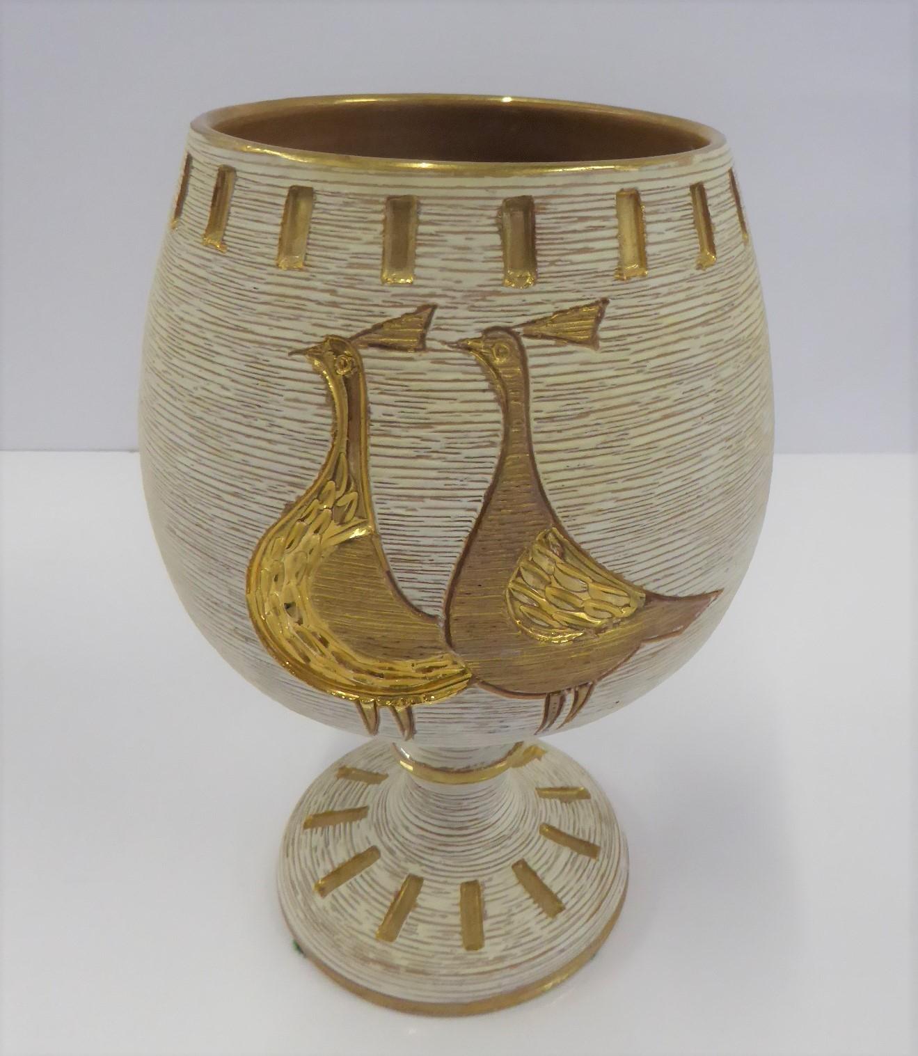 REDUCED FROM $325....Italian Modern Chalice shaped textured pottery vase by Fratelli Fanciullacci  from the 1960s.  The hand painted vessel is decorated with gold colored pair of quail or pheasants on a creamy white background on one side.  The body