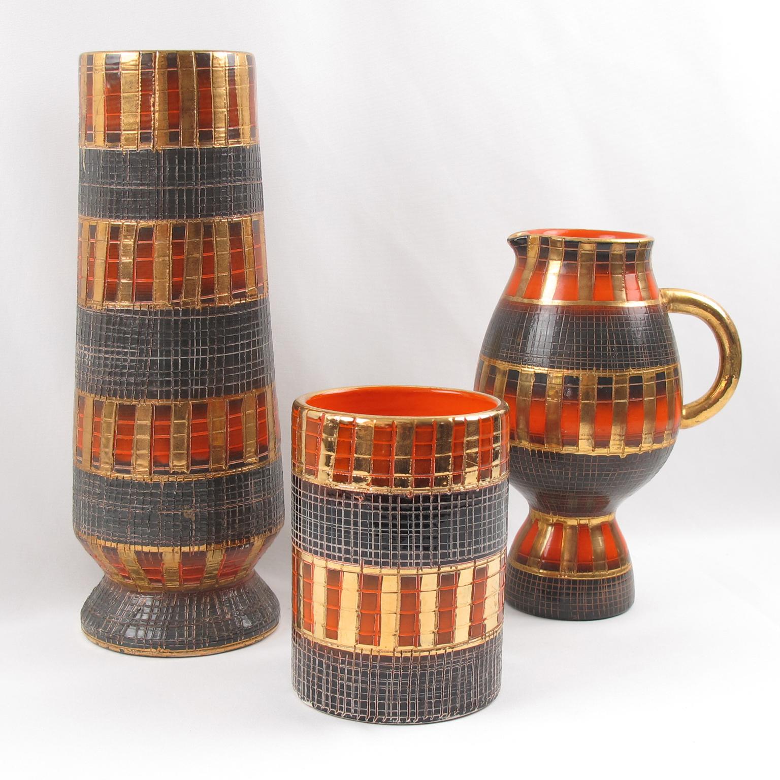 Beautiful 1950s Mid-Century Modern handcrafted and hand-decorated set of three vases by Fratelli Fanciullacci for Bitossi and imported by Raymor. Italian art ceramic two vases and one pitcher with unique sgraffito design.
Those pieces lean more