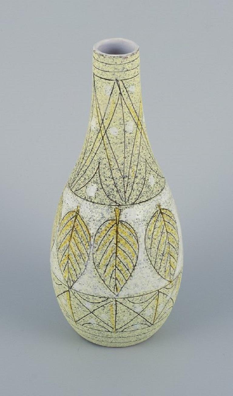 Fratelli Fanciullacci, Italy.
Unique ceramic vase decorated with leaves in yellow and white shades.
1960s/1970s
Signed.
Dimensions: H 23.5 x D 9.5 cm.

The brothers Fanciullacci were prolific Italian ceramicists, whose work is becoming widely