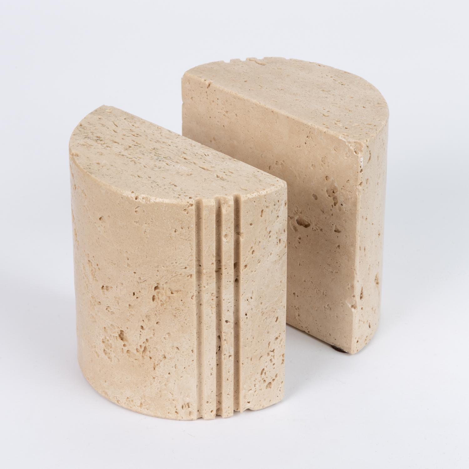 My grandmother always said if you want a house to sell, you have to paint all the walls beige. Apparently that extends to accent pieces as well, because anytime we get a travertine piece into the store it moves quickly. These substantial bookends,