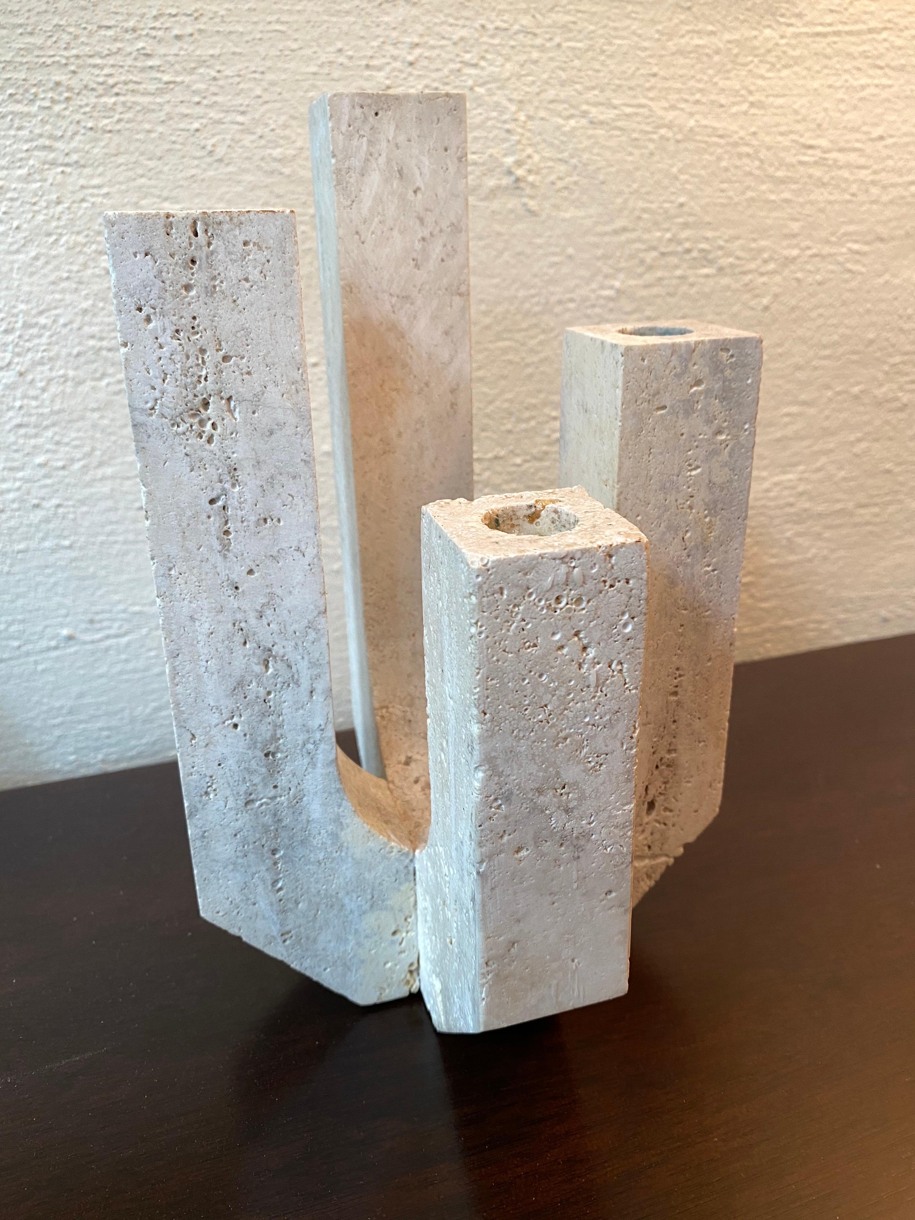 Fratelli Mannelli travertine 4 arm candlestick in travertine. Sculptural form, nicely crafted! I've seen these before with a Raymor Label who was an importer.