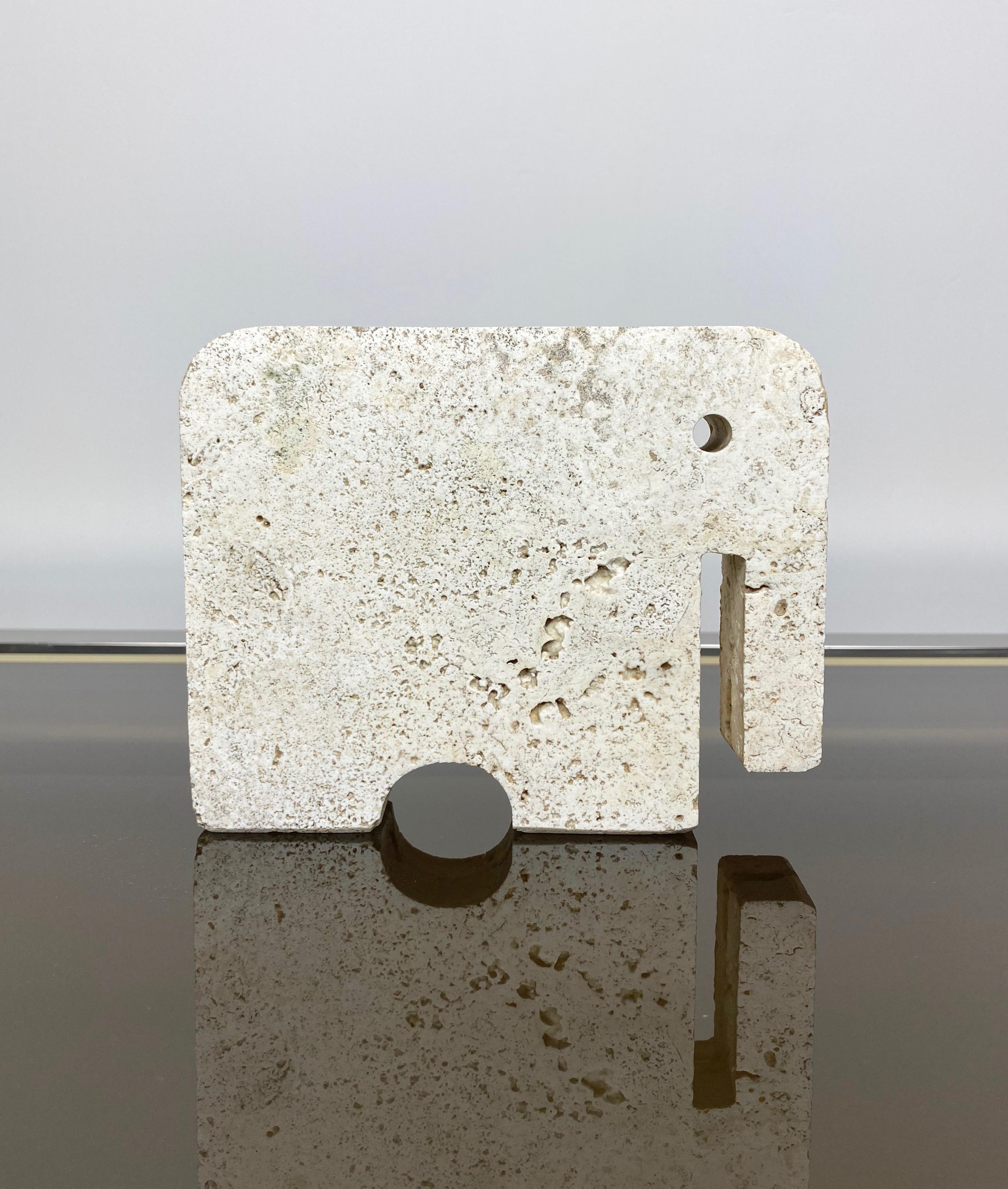 Elephant sculpture in travertine marble by the Italian designers Fratelli Mannelli, 1970s. 

Original labels still attached: one which states 