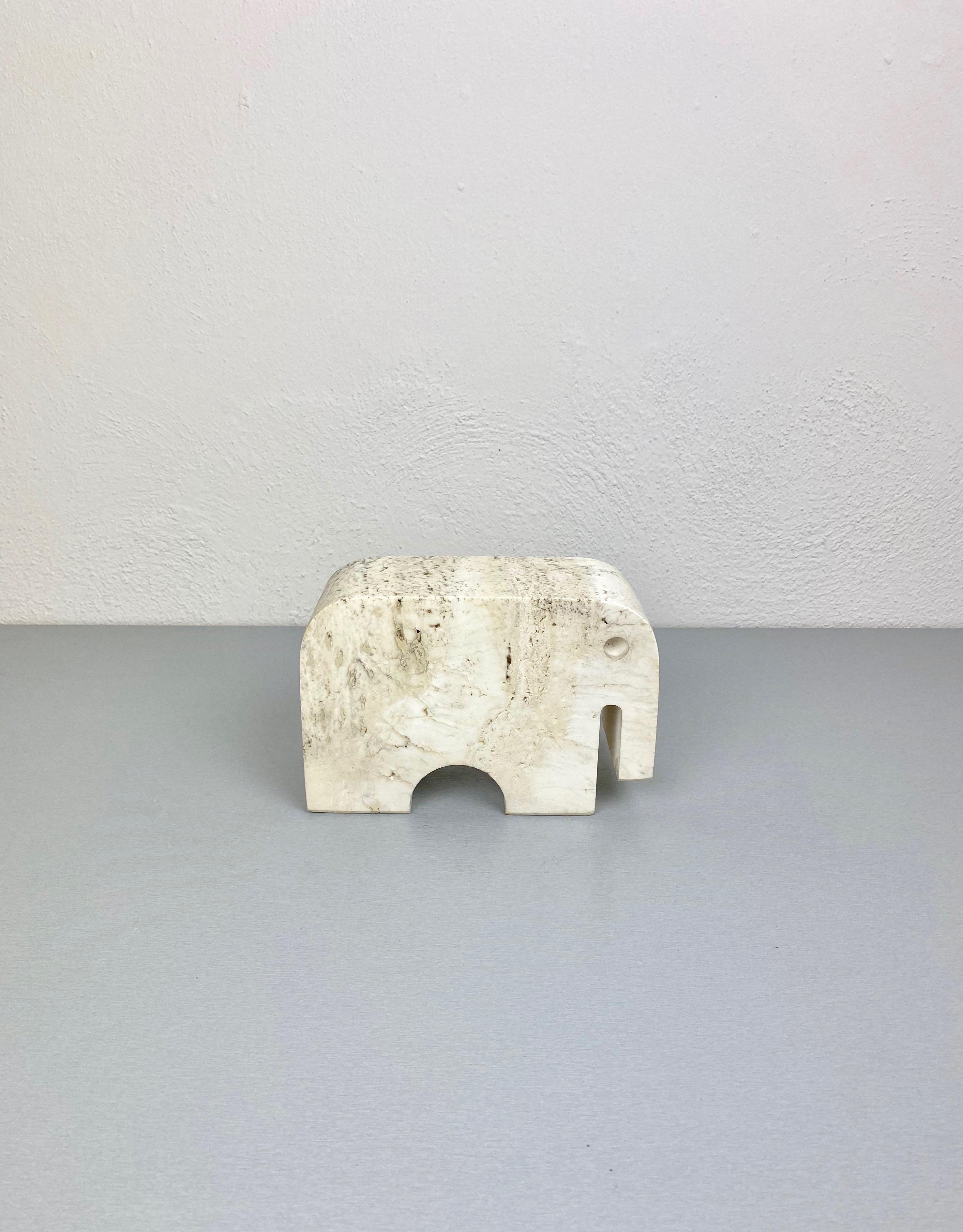 Elephant sculpture in travertine marble by the Italian designers Fratelli Mannelli, 1970s. 

Original labels still attached: one which states 