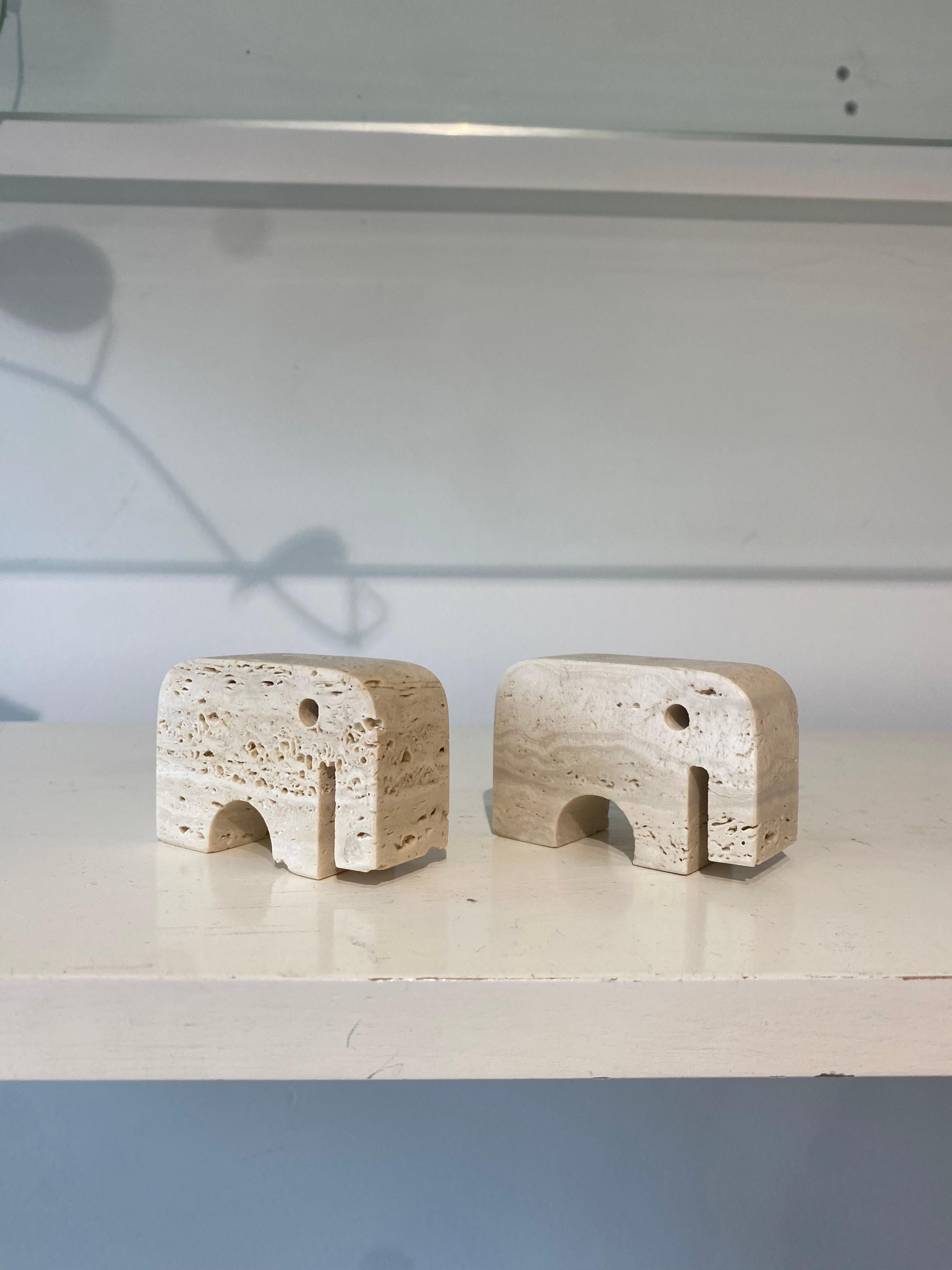 Sculpted travertine elephant pair by Fratelli Mannelli of Italy, circa the 1970’s. 

In excellent condition. 

Slight variance in size between the two due to the handmade nature.
