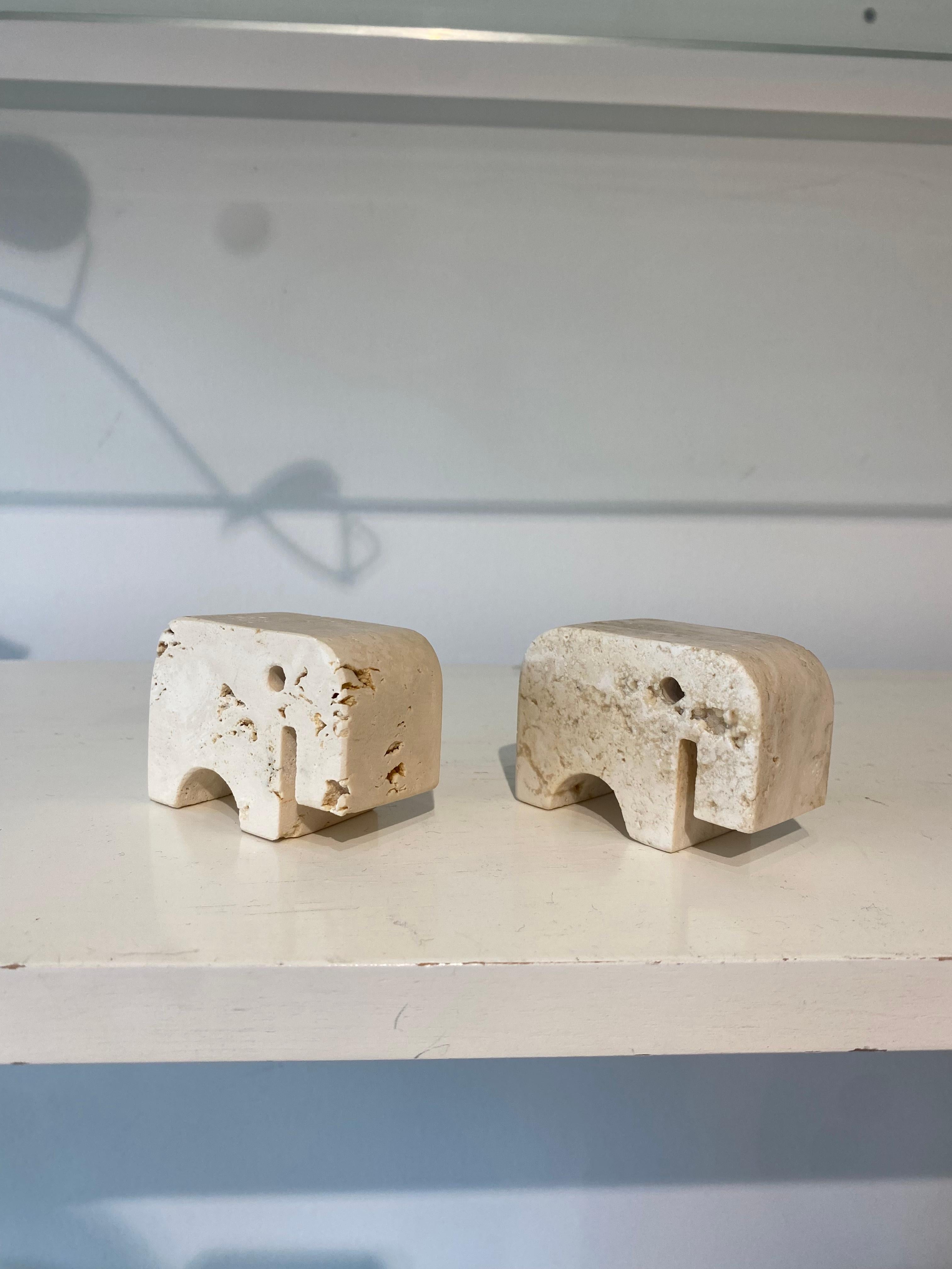 Sculpted travertine elephant pair by Fratelli Mannelli of Italy, circa the 1970’s. 

In excellent condition. 

Slight variance in size between the two due to the handmade nature.