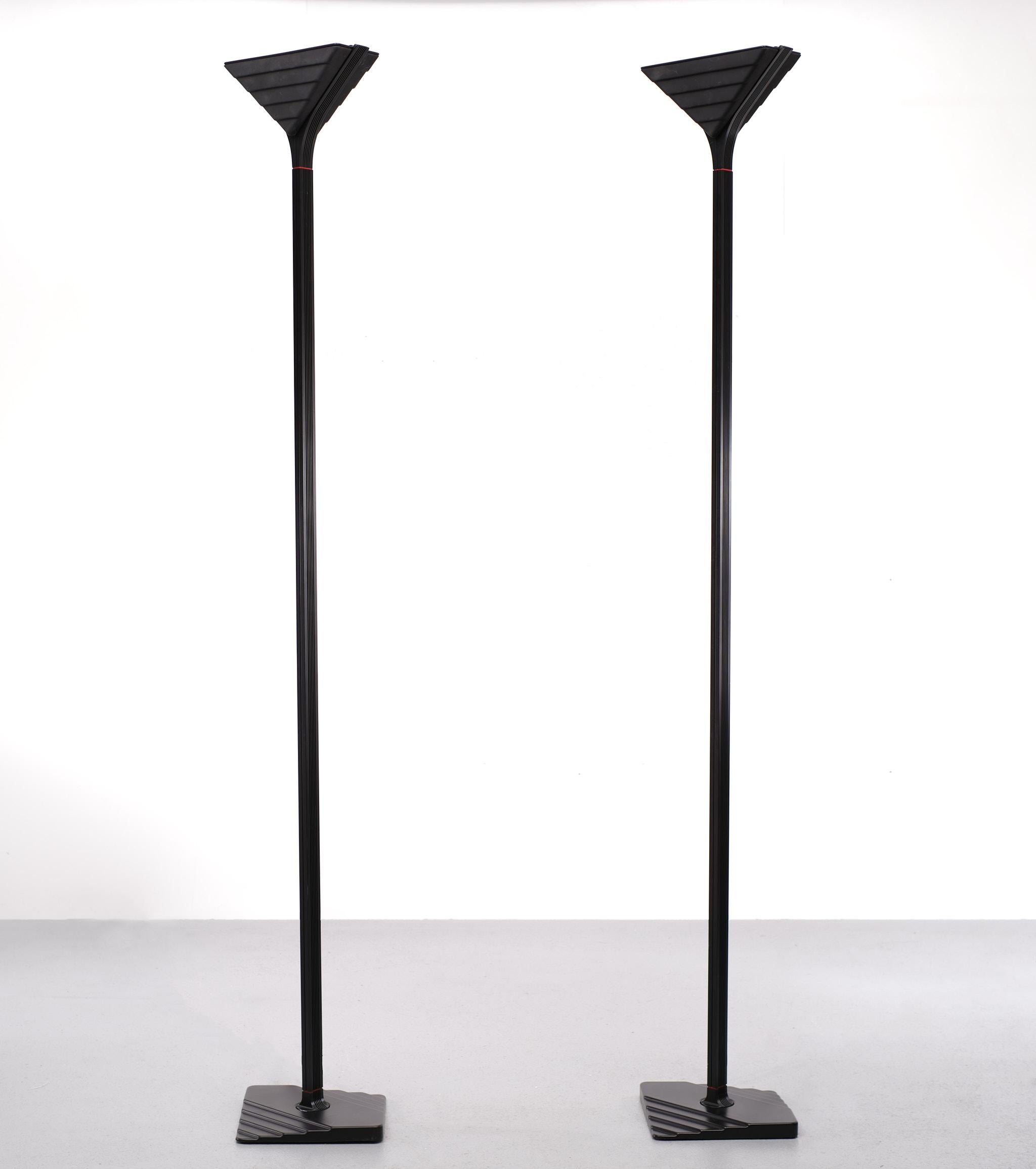 Set Very nice identical Halogen floor lamps. Black Aluminum upright, comes with 
a Black Glass triangle shade. Straight out off Star Trek. Gives a warm Purple 
light when lid. Beautiful working dimmer. New old stock. So very good condition.
 