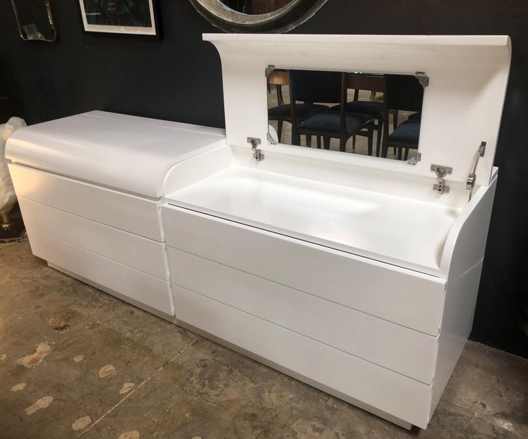This lovely buffet or cabinet from the 1970s (Italy) by Fratelli Saporiti has all been beautifully restored. It is newly white lacquered.
This can also be a dresser or vanity desk opening the top with a mirror inside.
The higher height of this