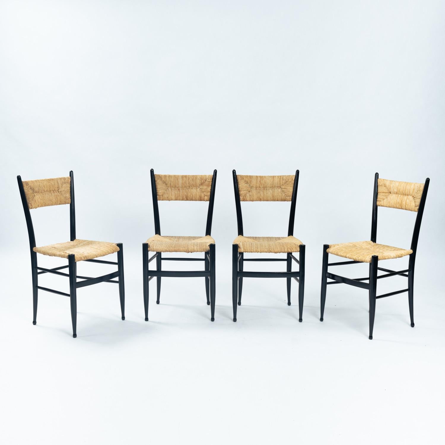 
Very elegant and rare set of 4 Chiavari chairs attributed to Guido Chiappe with straw seats and backrests.

The chairs are comfortable and in good condition.
Some wear on the straw and legs, overall in good condition overall.

Measurements:

87xm X