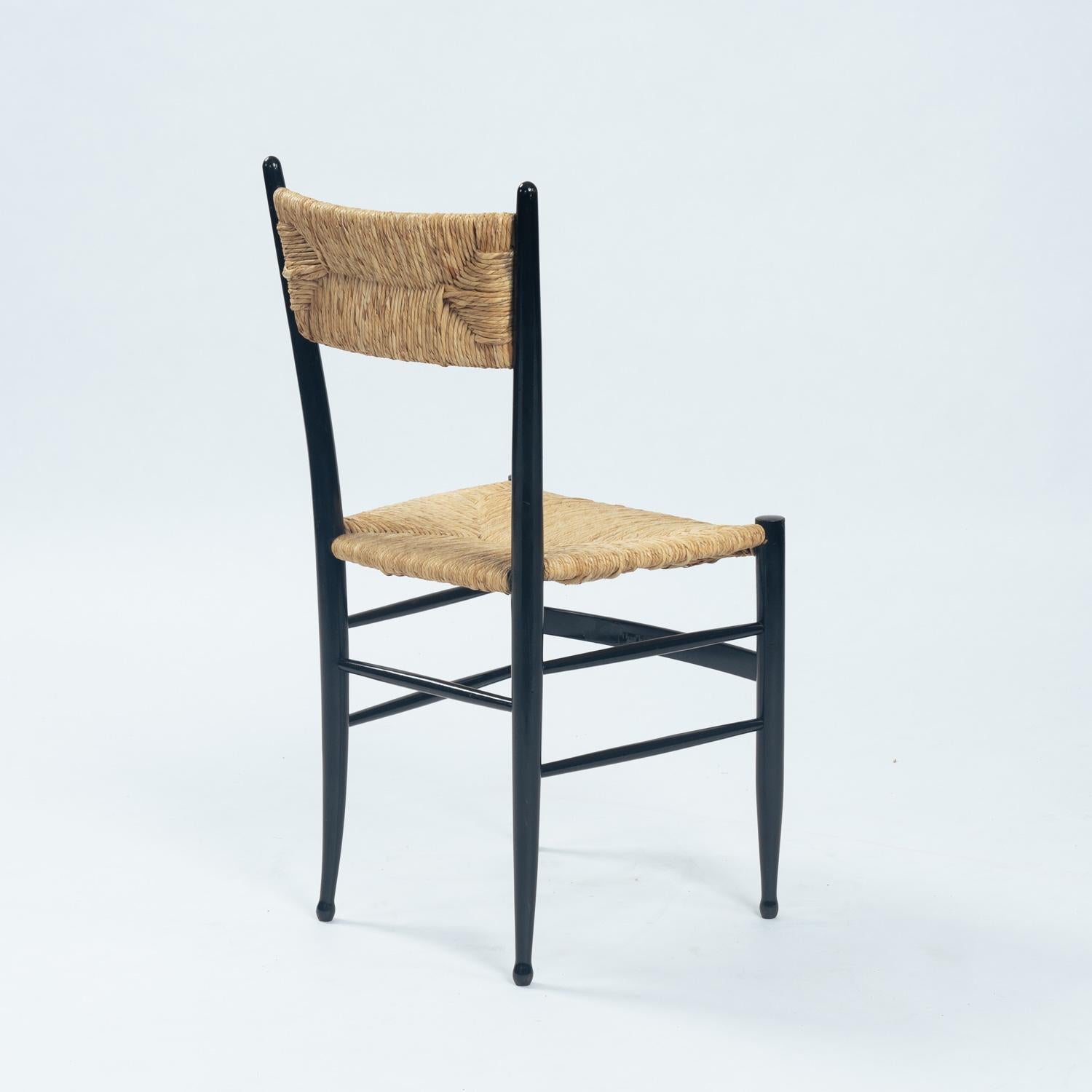 Blackened Fratelli Spinetto Chiavari Dining Chairs in black ebonized Wood, Straw, Italy For Sale