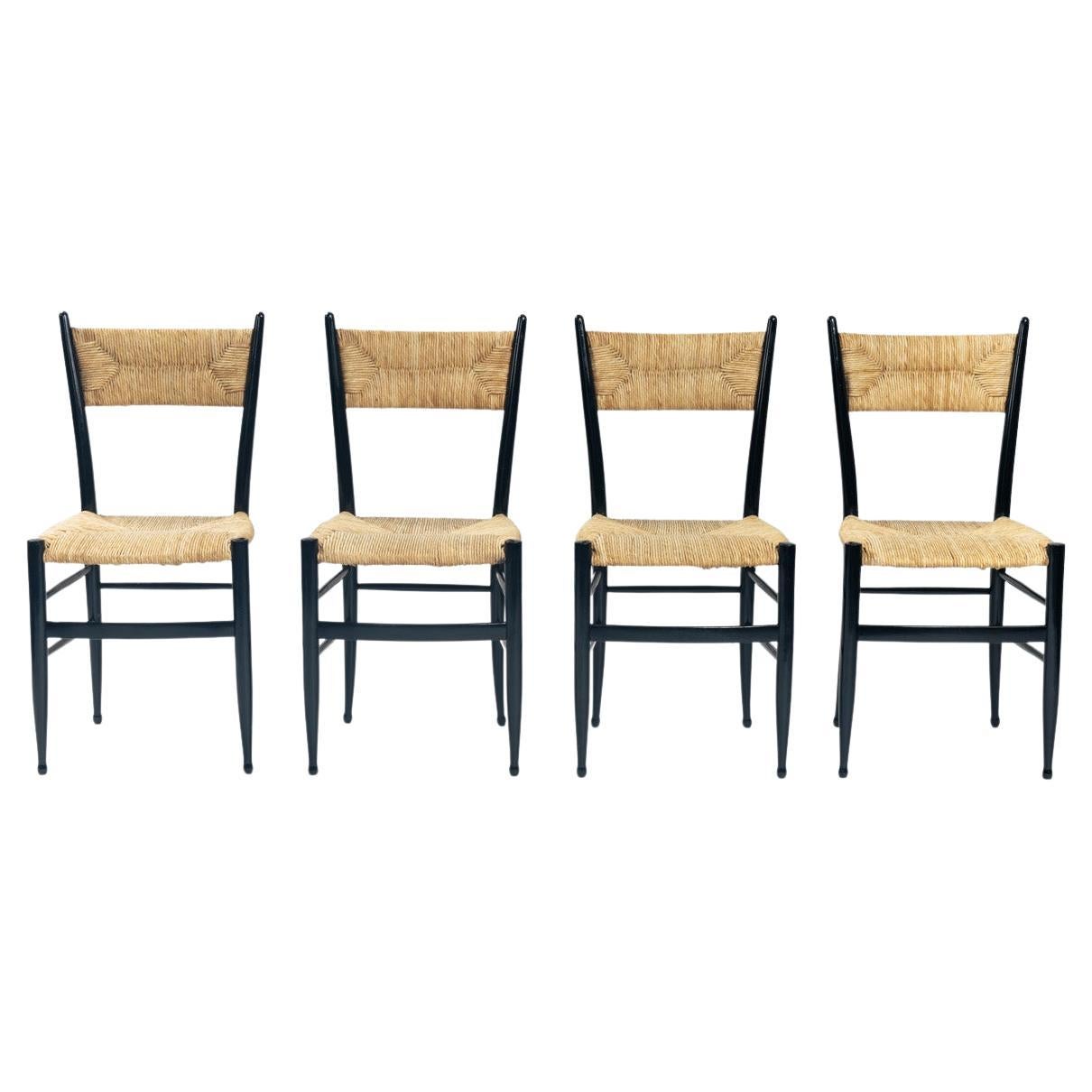 Fratelli Spinetto Chiavari Dining Chairs in black ebonized Wood, Straw, Italy For Sale