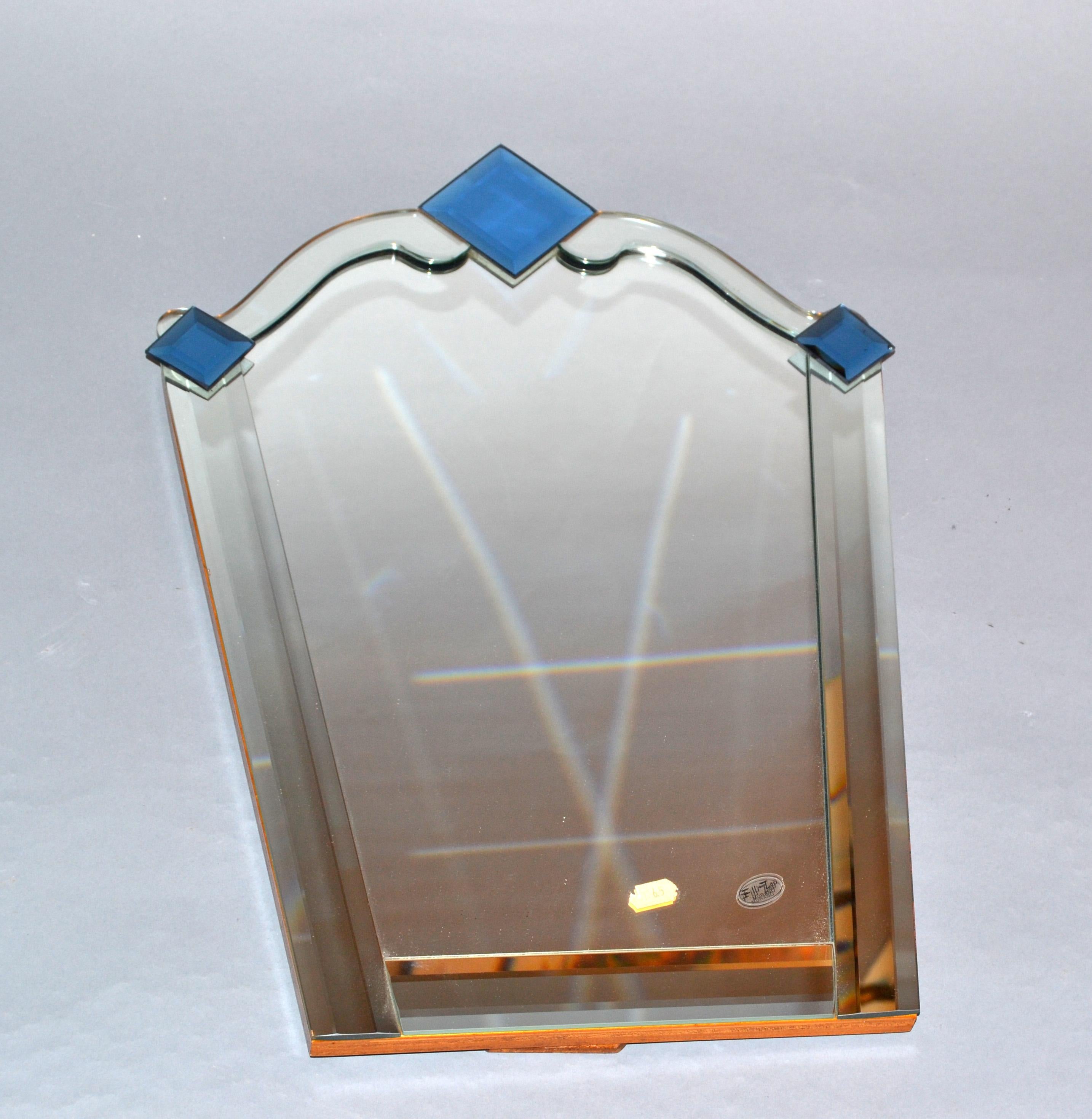 Graceful Fratelli Tosi Venetian glass vanity or table mirror with blue beveled Murano glass elements.
Made in Italy, makers mark on the mirror.
The reverse is made out of solid wood.