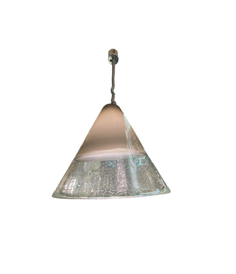 A beautiful hand blown glass shade pendant light by famous glass house Fratelli Toso Vetreria of Murano, Italy. The cone shape shade is hand blown in colored and clear glass. The top is of the cone is a taupe beige color layered over white showing