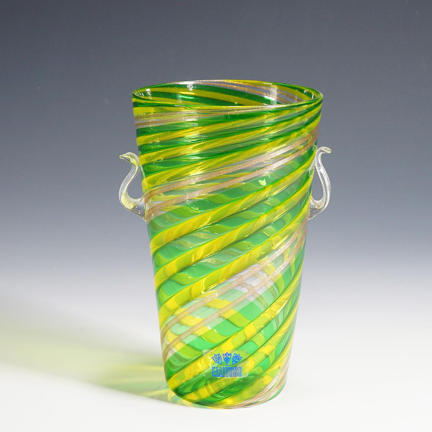 Fratelli Toso 'A Canne' vase with Aventurin, Murano, Italy ca. 1965

A Fratelli Toso a Canne glass vase manufactured ca. 1965. Made by hot fusion of clear, green, yellow and aventurin glass sticks. The company label is on the