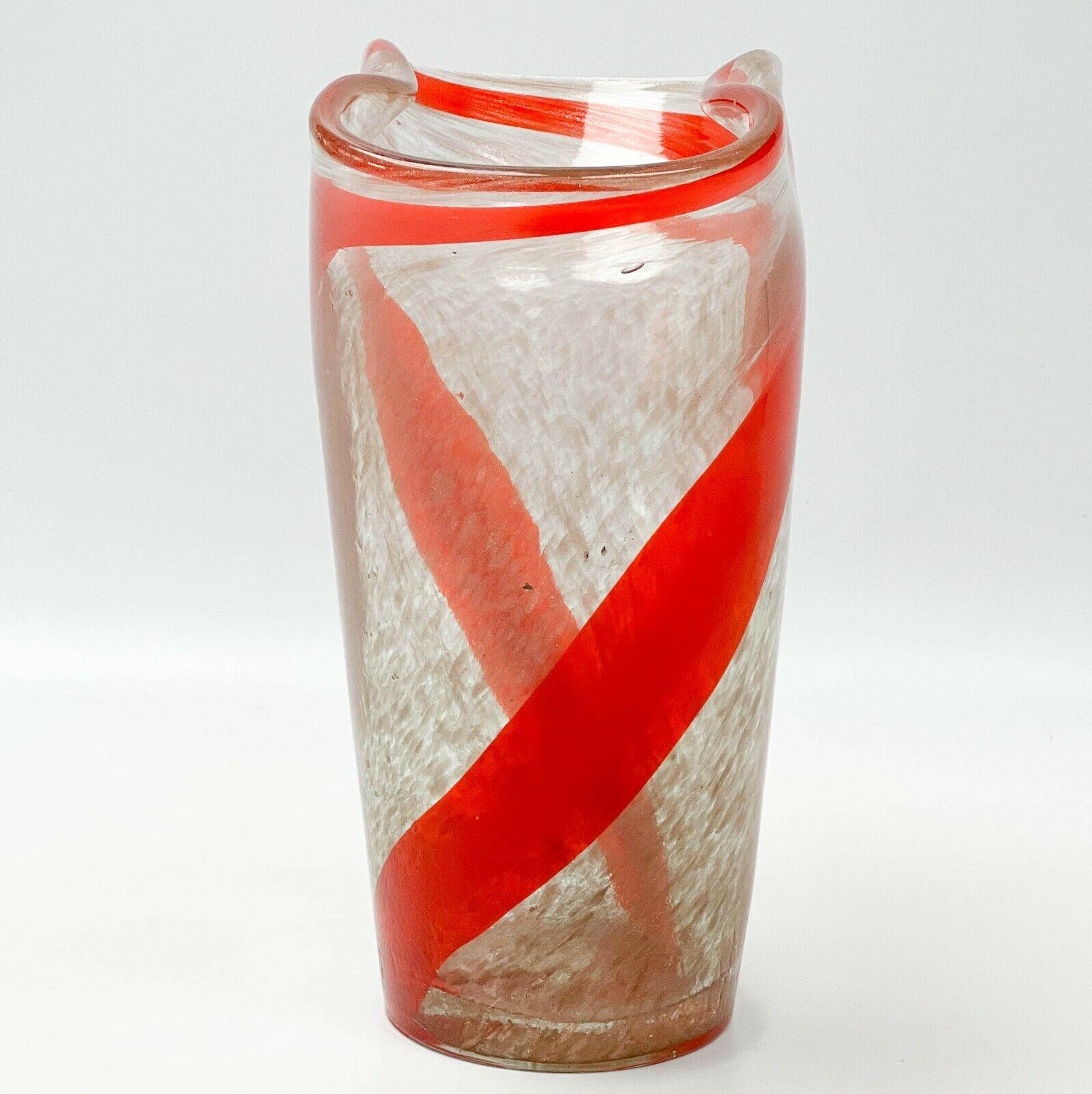 Fratelli Toso Italian Murano Art Glass Aventurine vase

Vase with Aventurine glass and a swirled red ribbon design with a curved rim. Murano label to the underside.

Additional Information:
Country/Region of Manufacture: Italy 
Material: