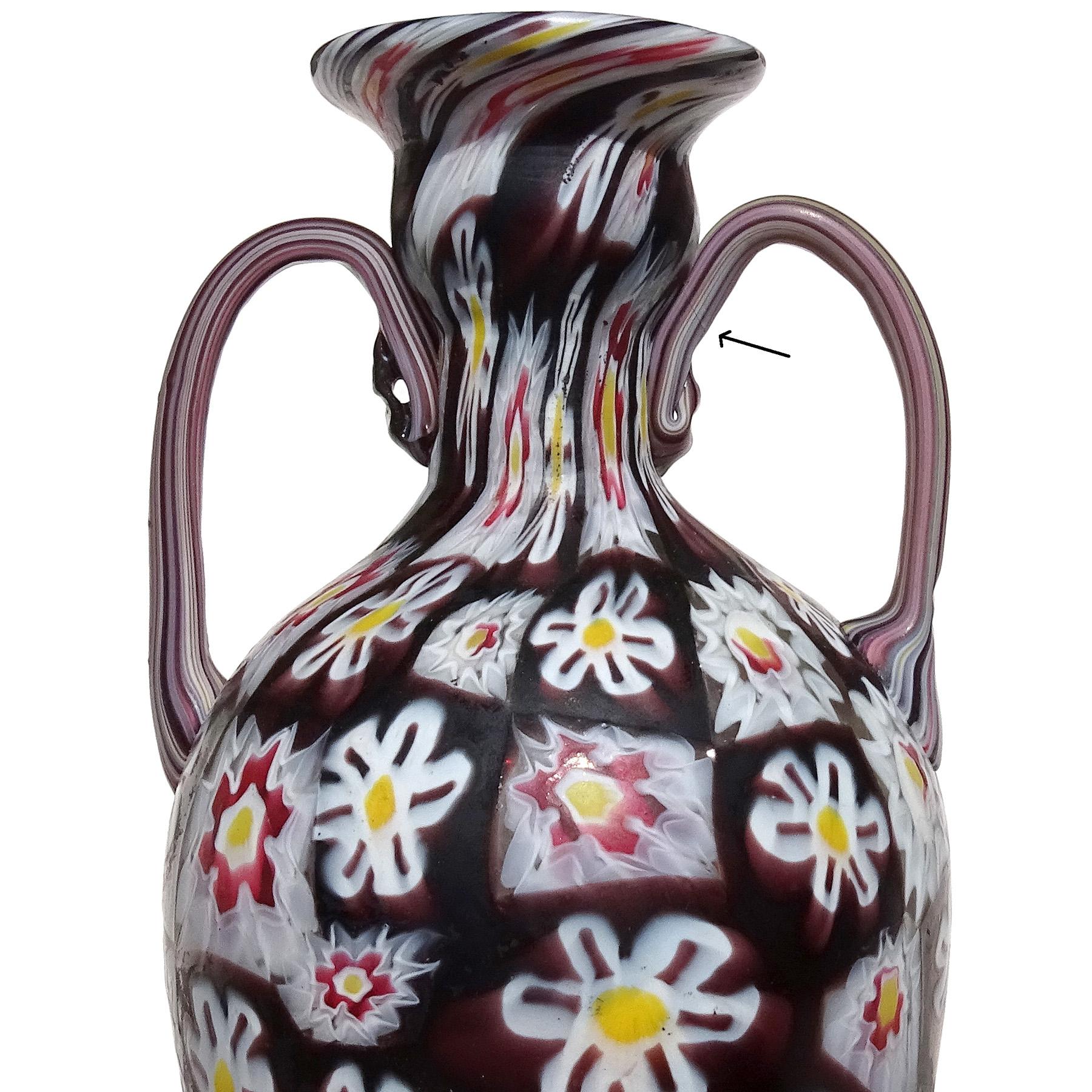 Beautiful and large, antique Murano hand blown Millefiori Murrina flower mosaic Italian art glass double handles vase. Documented to the Fratelli Toso company, circa 1900-1920. Amazingly the vase still remains an original and very old gallery label.