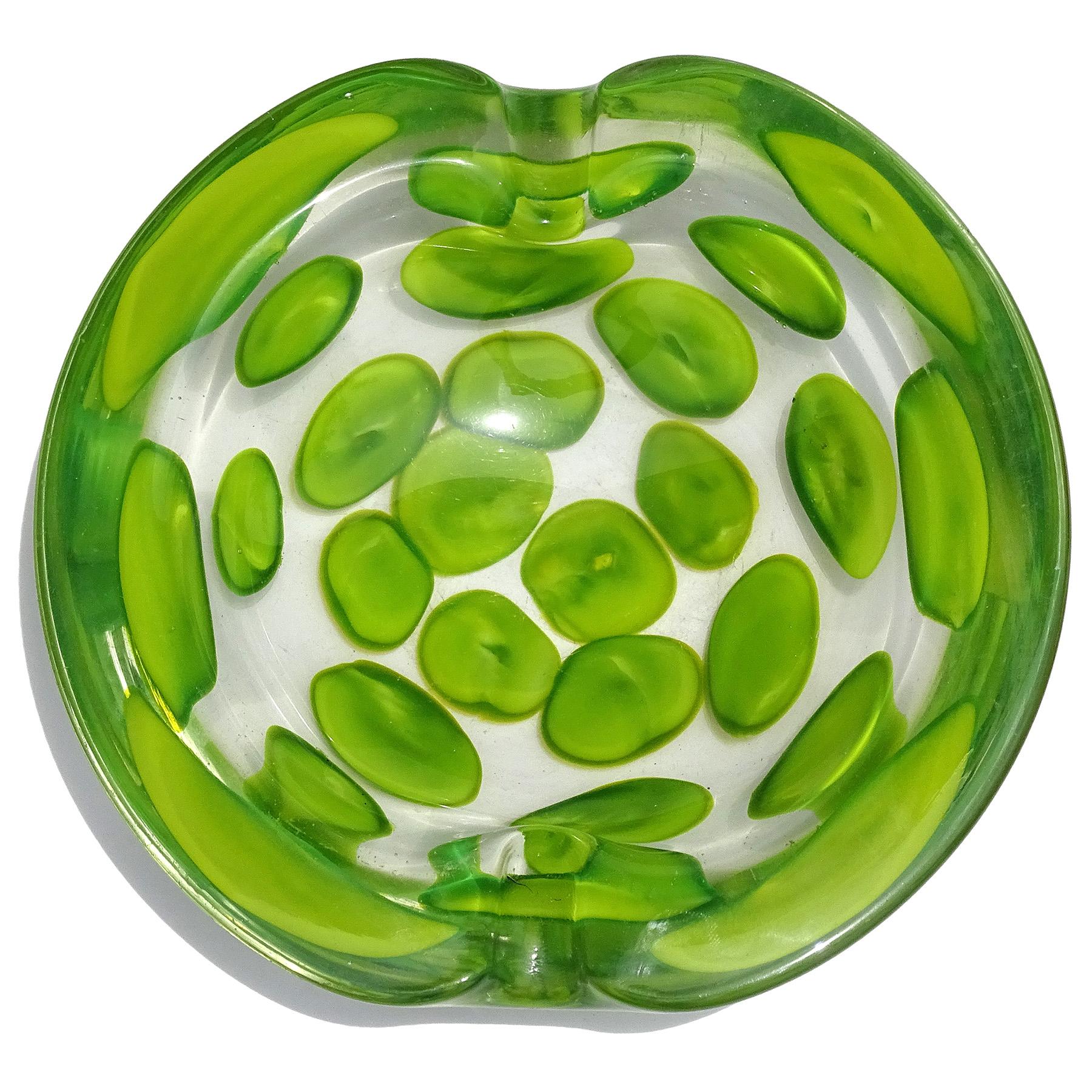 Beautiful and very rare Murano hand blown apple green spots Italian art glass decorative bowl or ashtray. Documented to designer Ermanno Toso for the Fratelli Toso company, circa 1962. Published design is in the Fratelli Toso book. The technique /