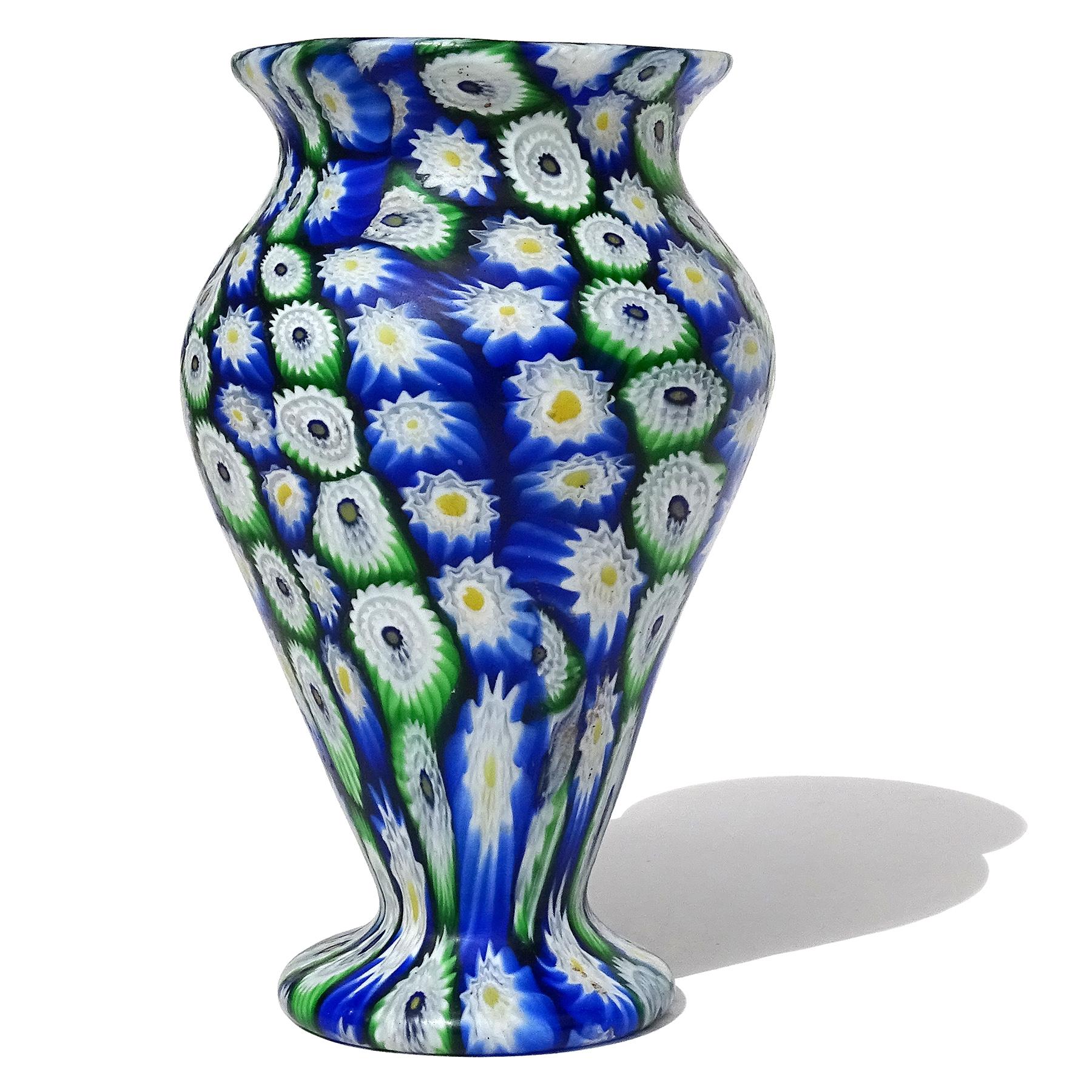 Beautiful antique Murano hand blown Millefiori Murrina flower mosaic Italian art glass decorative flower vase. Documented to the Fratelli Toso company, circa 1910-1930. Created in a classical shape with an alternating pattern of vertical rows in 2