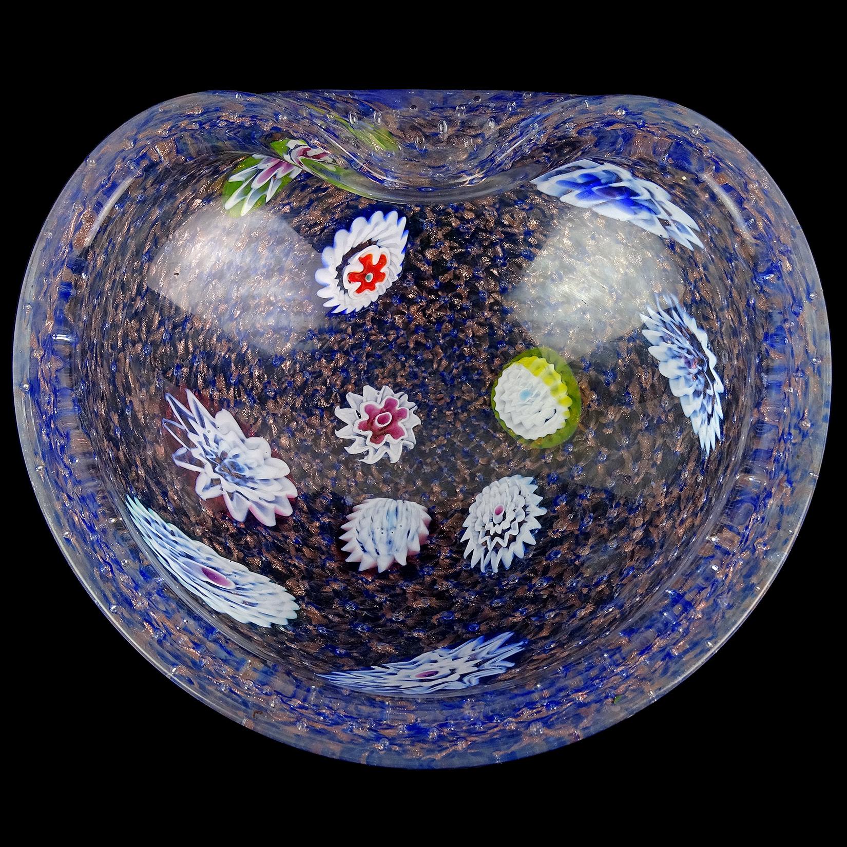 Beautiful vintage Murano hand blown cobalt blue, bubbles and millefiori flower murrines Italian art glass bowl. Documented to the Fratelli Toso company. The bowl has 11 large flower canes throughout it, and the color is made with little cobalt blue