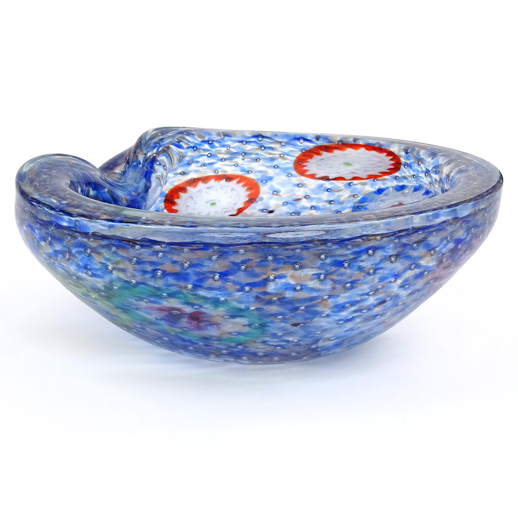 Beautiful vintage Murano hand blown blue, aventurine, bubbles and large millefiori flower murrines Italian art glass bowl. Documented to the Fratelli Toso company. The bowl has 11 large flower canes throughout it, and the color is made with little