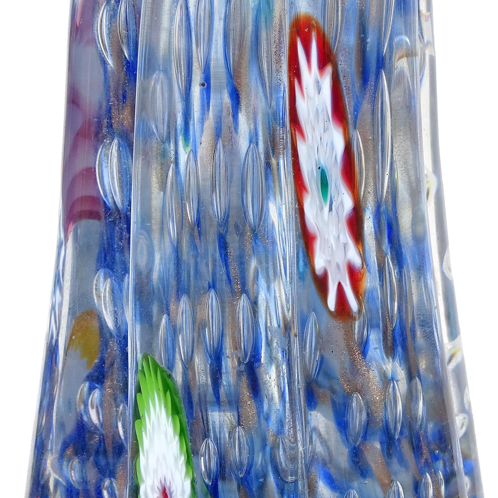 Beautiful vintage Murano hand blown millefiori flower murrines Italian art glass Christmas tree sculpture. Documented to the Fratelli Toso company. It is made with controlled bubbles, cobalt blue dots and copper aventurine flecks. The tree has about