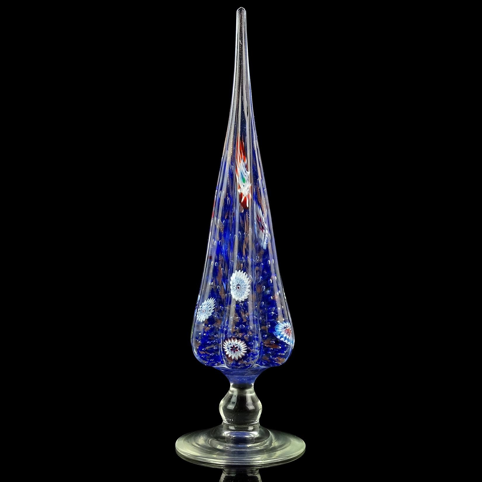 Beautiful vintage Murano hand blown millefiori flower murrines Italian art glass Christmas tree sculpture. Documented to the Fratelli Toso company. It is made with controlled bubbles, cobalt blue dots and copper aventurine flecks. The tree has many