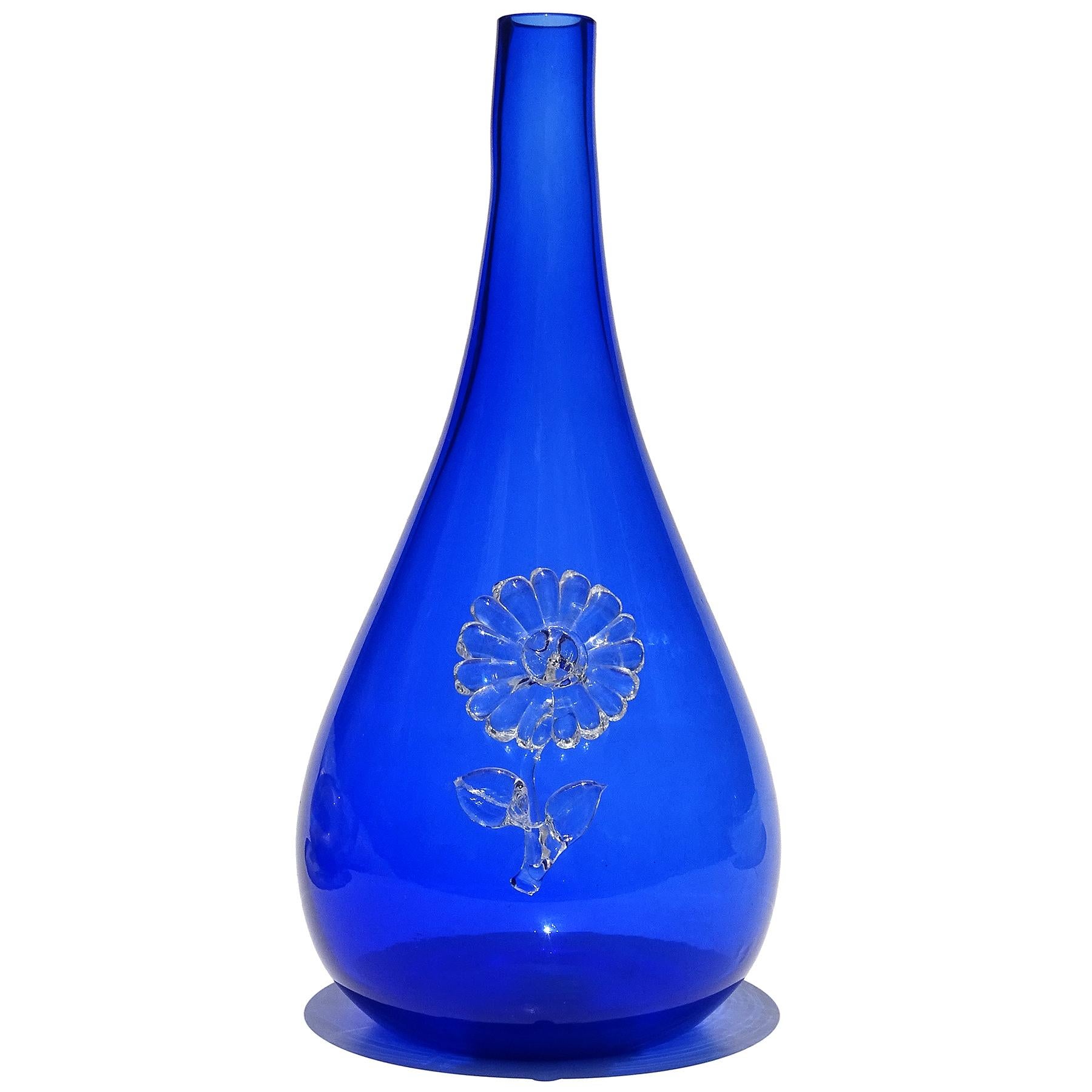 Beautiful, and unusual, vintage Murano hand blown rich cobalt blue with applied flower decoration Italian art glass soliflore / specimen flower vase. Documented to the Fratelli Toso company. A similar piece (in decanter form) is published in the