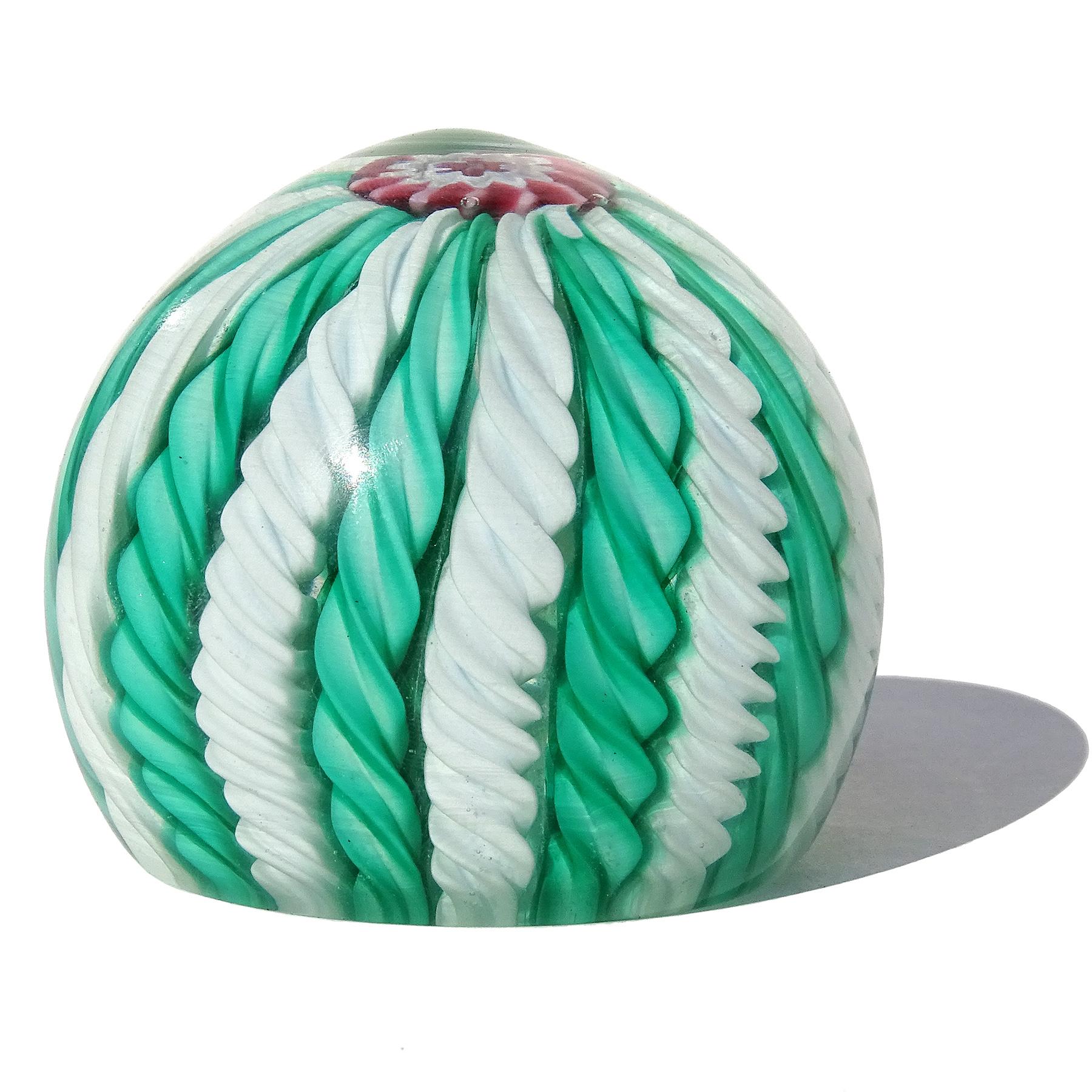 Beautiful and colorful vintage Murano hand blown green and white twisting ribbons Italian art glass paperweight. Documented to the Fratelli Toso company. This paperweights are often referred to as 