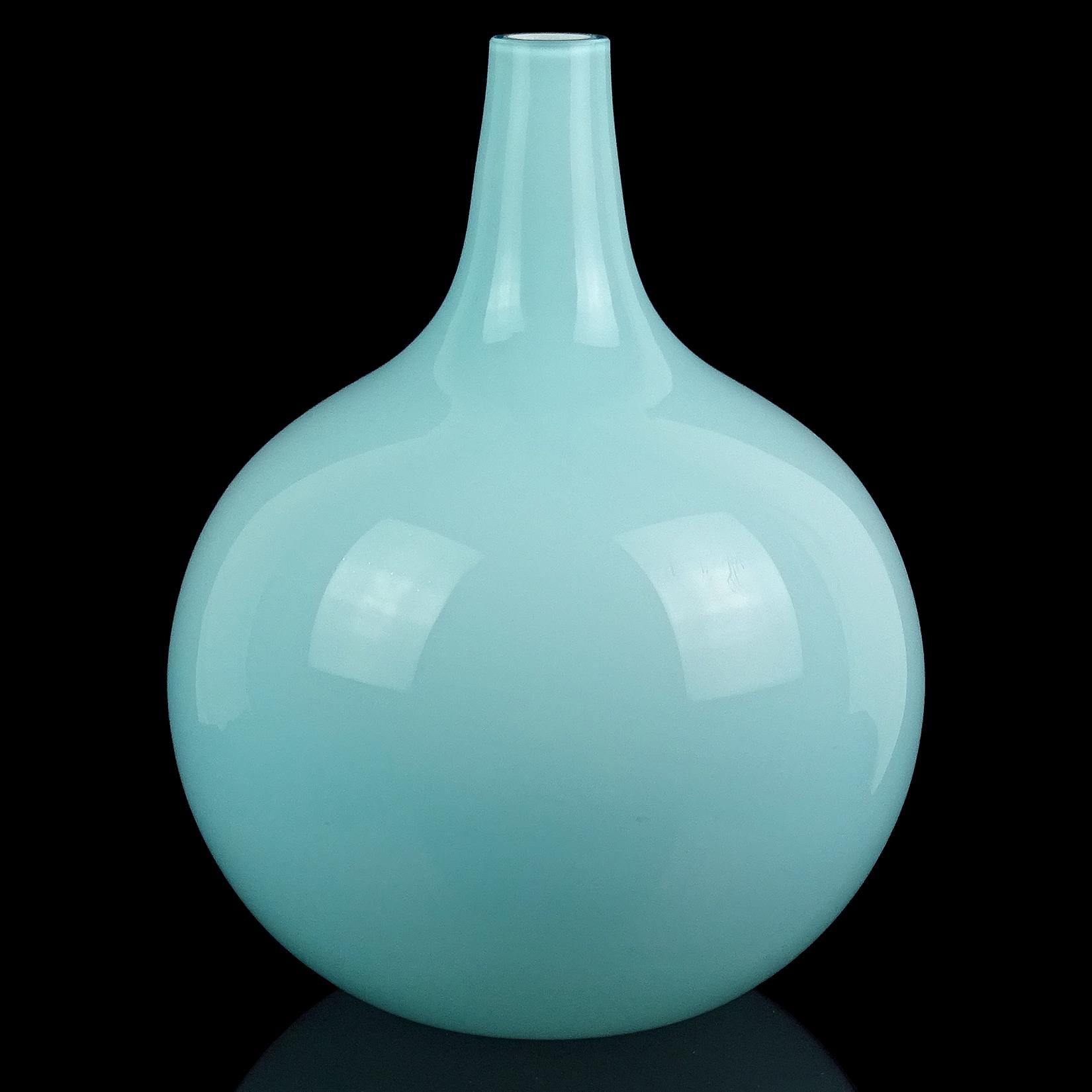 Beautiful vintage Murano hand blown light sky blue over white Italian art glass round ball shaped flower vase. Documented to the Fratelli Toso company, with original 