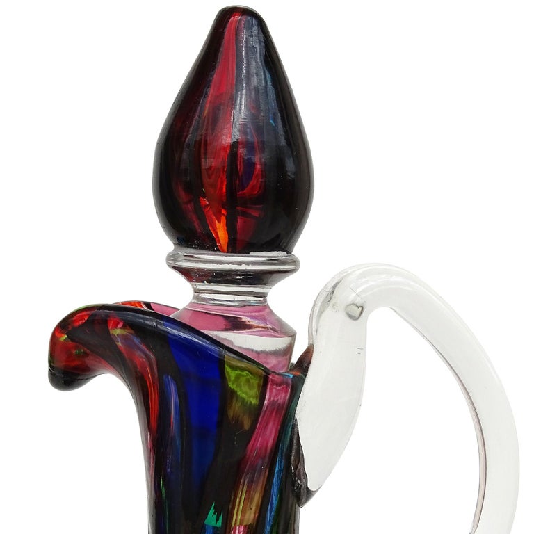 Beautiful, vintage Murano hand blown multi-color murrine with metallic black Italian art glass mosaic ewer, cruet. Documented to the Fratelli Toso company. The murrines pieces are all lined in metallic black, like stained glass windows. It has