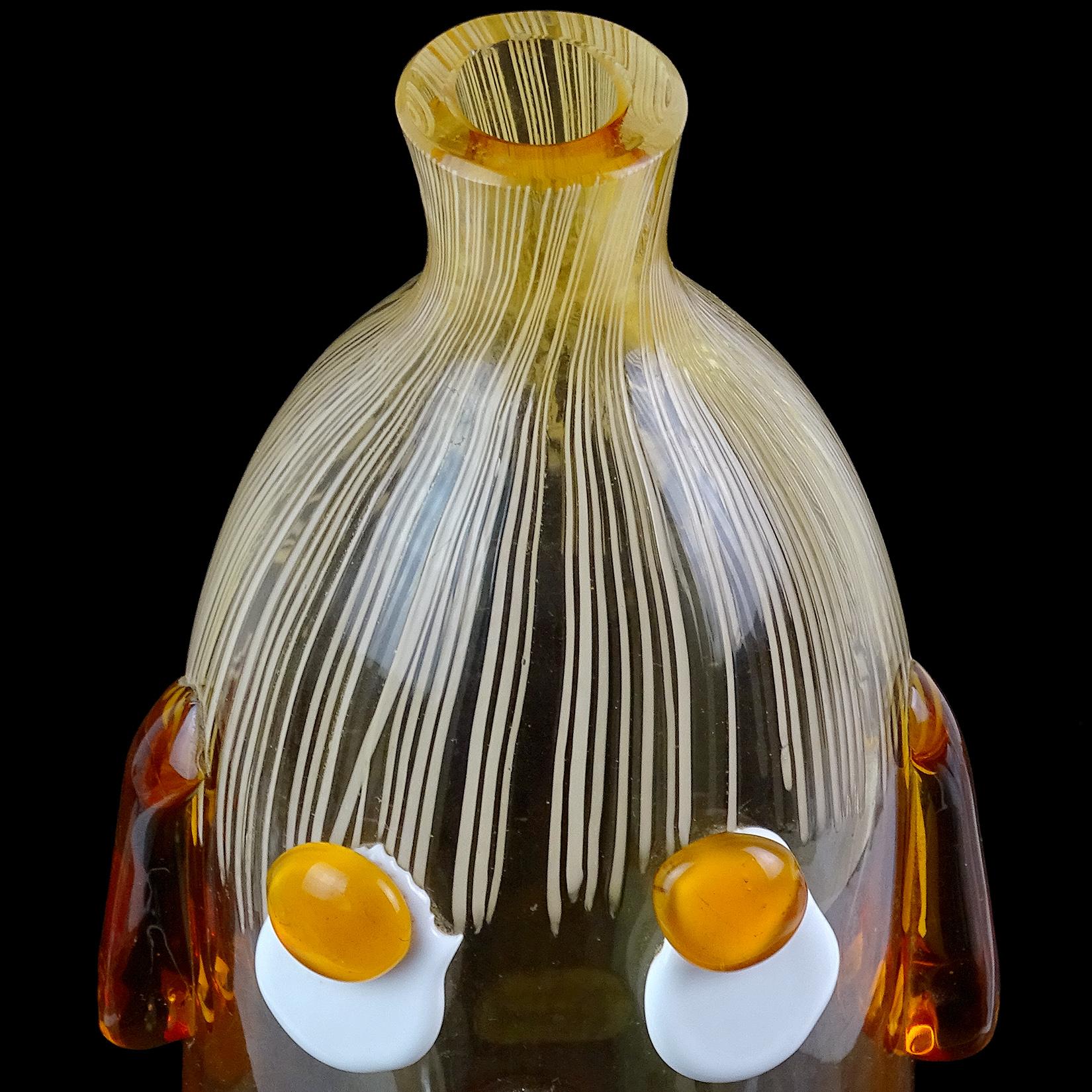 Cute and unusual Murano hand blown orange Italian art glass decanter with clown face. Documented to the Fratelli Toso Company. It still retains a worn 