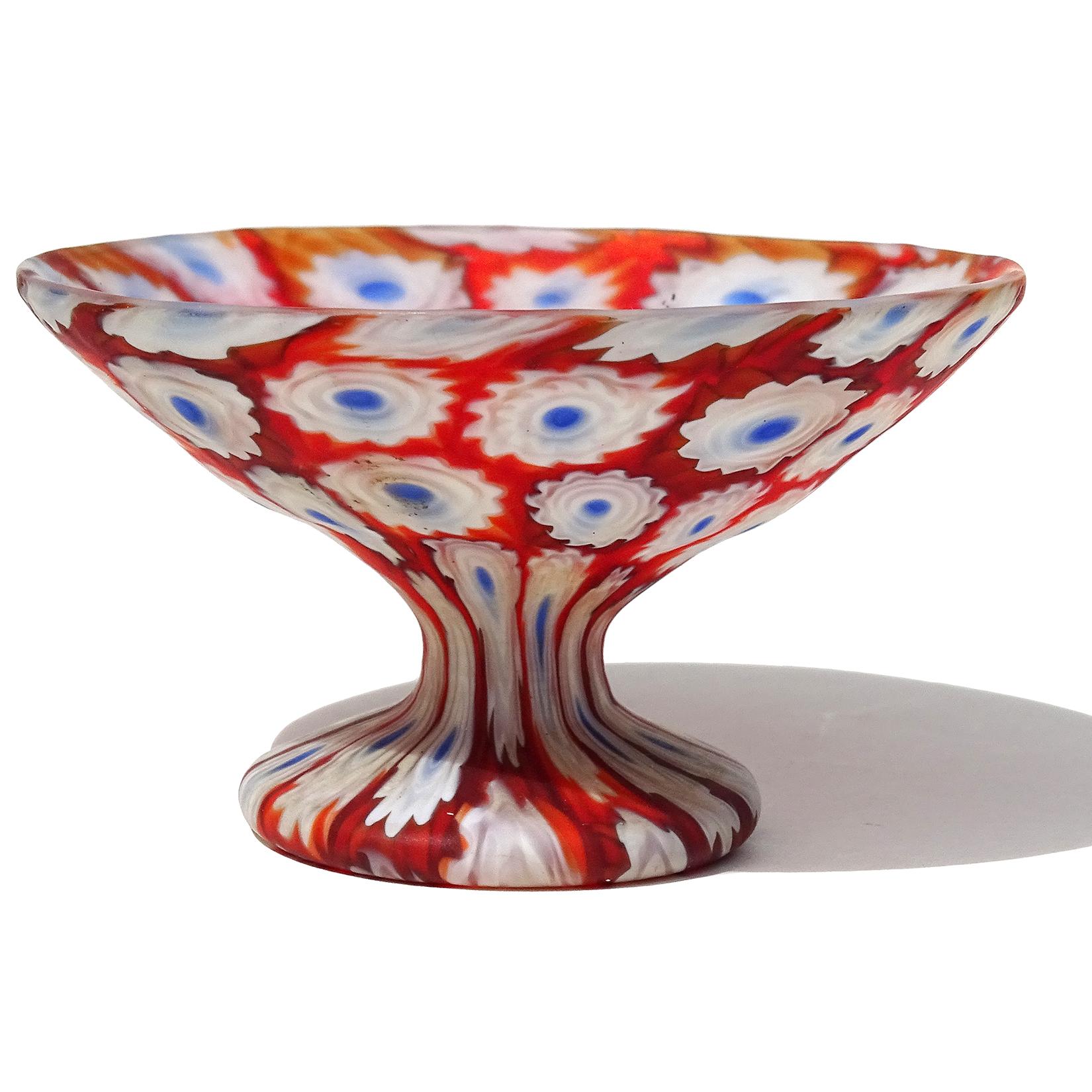 Beautiful antique murano hand blown red, white and blue millefiori flower mosaic Italian art glass decorative footed bowl / cup. Documented to the Fratelli Toso company, circa 1910-1930. Great contrasting colors. Would make a great ring dish. Art