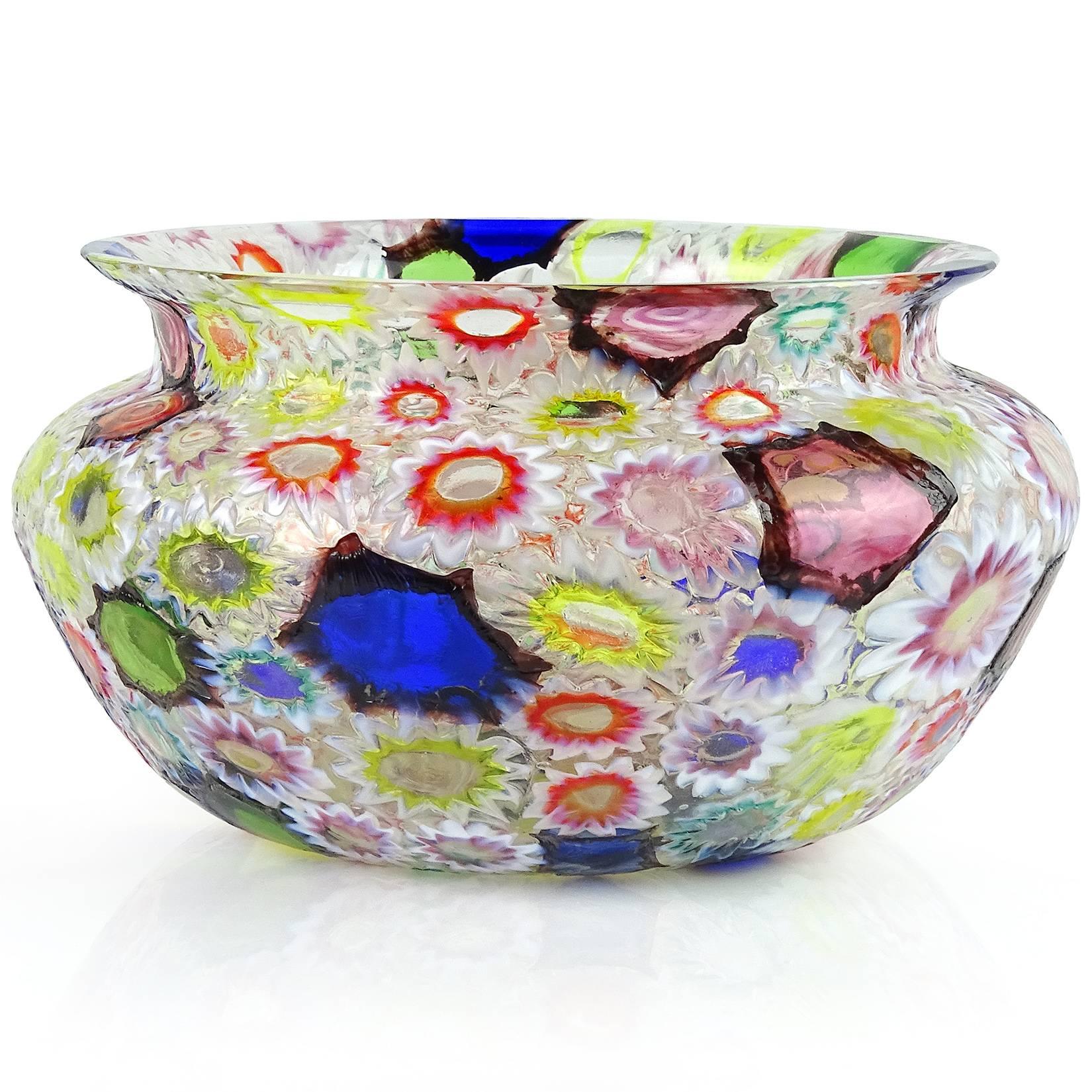 Gorgeous Murano hand blown multi-color Millefiori flower and star mosaic Italian art glass bowl or low flower vase. Documented to the Fratelli Toso company. Many of the murrines are lined in opal white, others are lined in metallic black. Matching