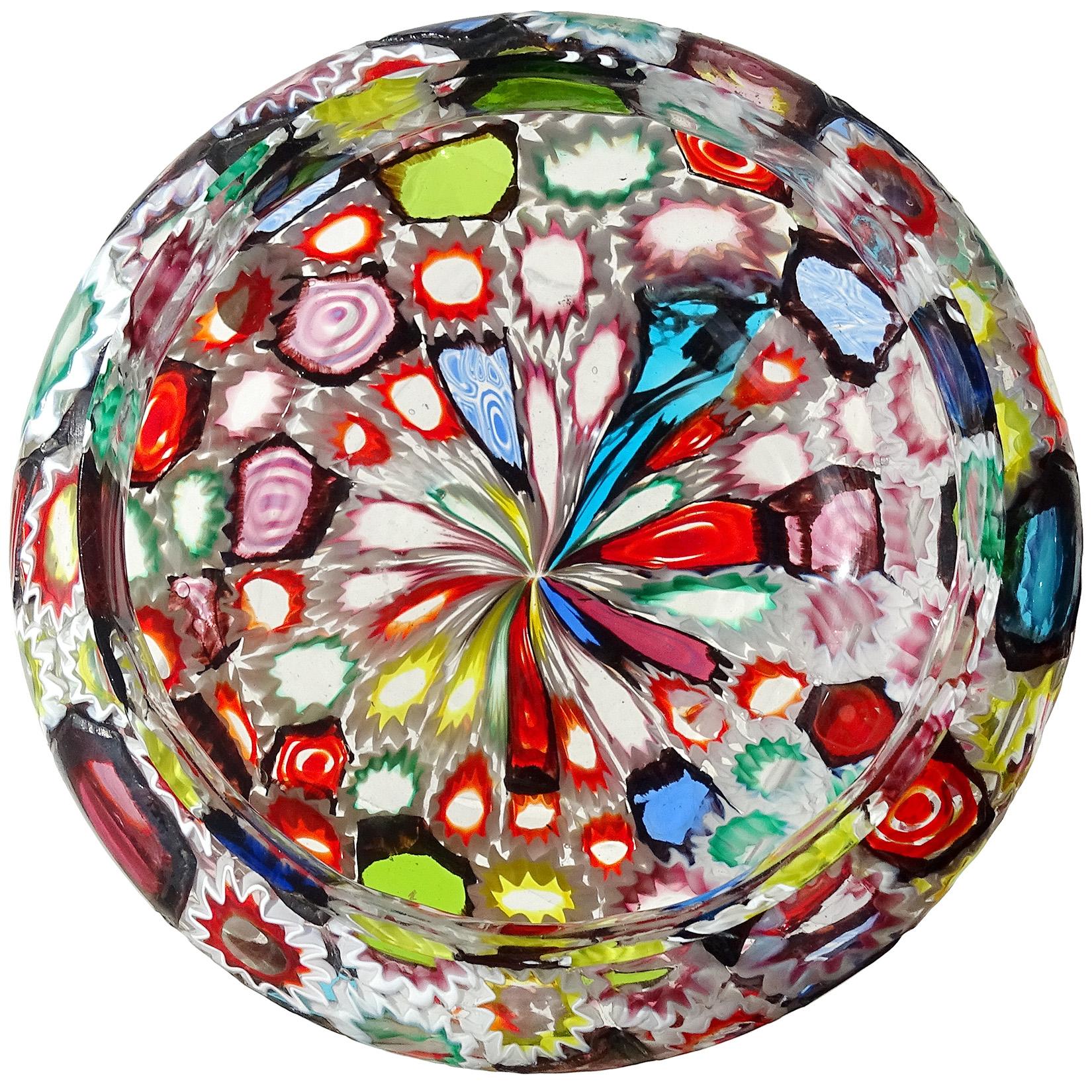Beautiful Murano hand blown multi-color Millefiori flower and star mosaic Italian art glass circular bowl. Documented to the Fratelli Toso Company. Many of the murrines are lined in white, and some are lined in a metallic black. Amazing stained