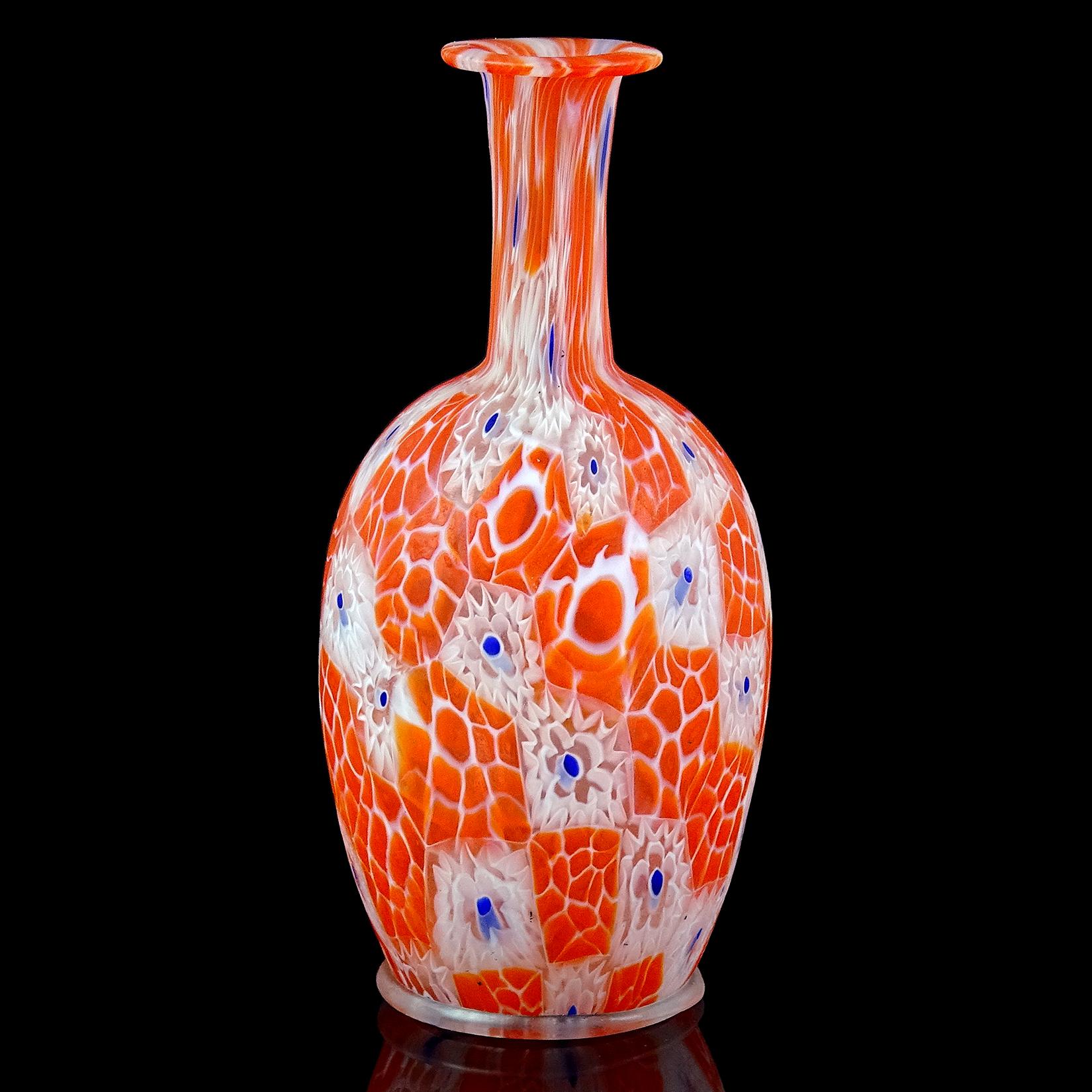 Beautiful antique Murano hand blown millefiori mosaic Italian art glass decorative cabinet vase. Documented to the Fratelli Toso Company, circa 1910-1920. Art Nouveau era. The vase has white with blue murrine flowers and orange beehive murrines. It