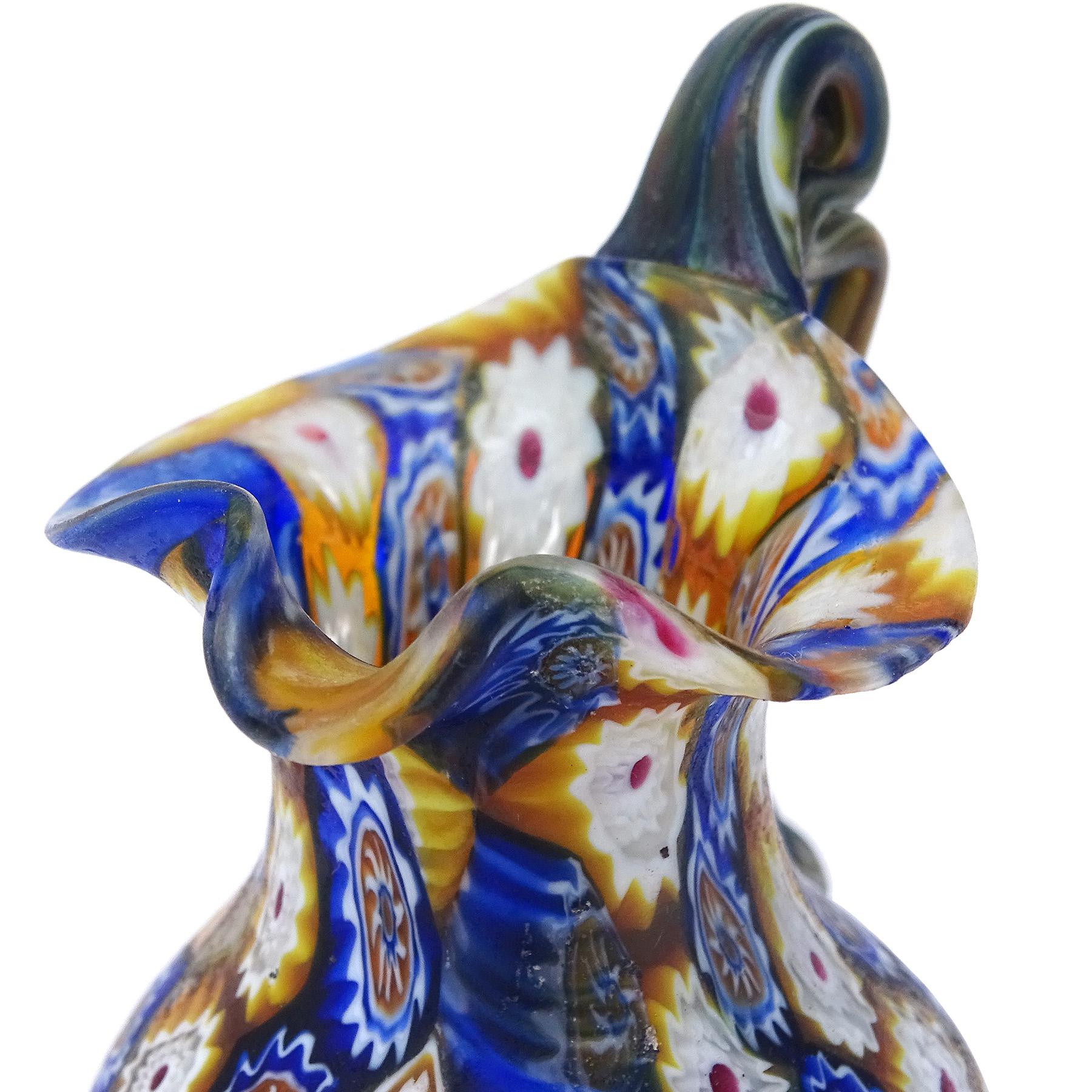 Beautiful antique Murano hand blown Millefiori Murrina flowers mosaic Italian art glass decorative cabinet vase / pitcher. Documented to the Fratelli Toso Company, circa 1910-1930. The piece has a vertical pattern, with multi layer murrines in