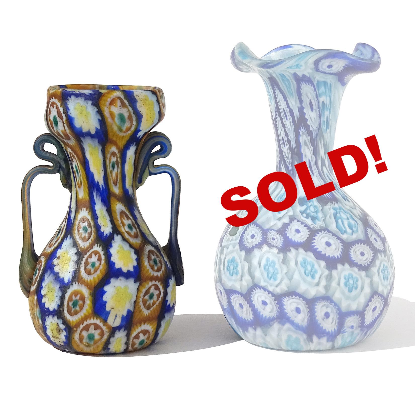 ONLY 1 Left! Beautiful antique Murano hand blown millefiori mosaic Italian art glass decorative cabinet vase. Documented to the Fratelli Toso company, circa 1910-1930. The vase has orange, yellow, white and blue flowers, with ornate handles.