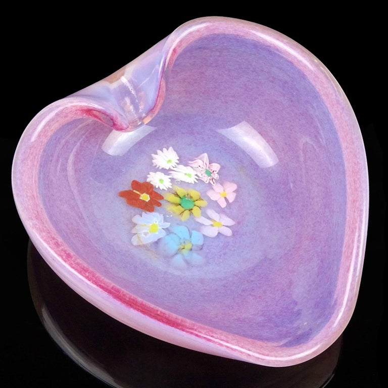 Beautiful vintage Murano hand blown pink spots and white opalescent Italian art glass heart shaped bowl with wild flower murrines. The piece is documented to Vetreria Fratelli Toso, circa 1950s. Would make a great display piece on any table. Use it