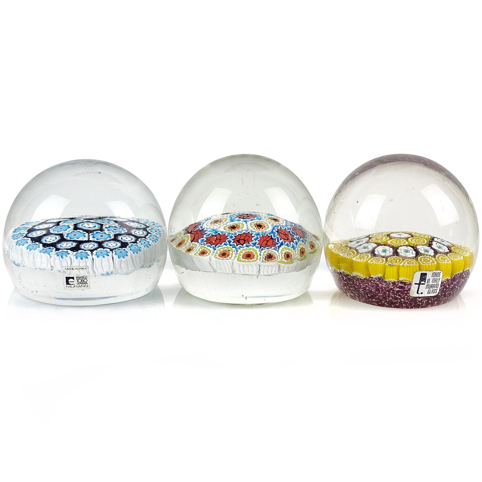 Priced per item (3 designs available, as shown). Beautiful vintage Murano hand blown Italian art glass paperweights. Documented to the Fratelli Toso company. Each is made with concentric circles of different flowers. The first is a yellow daisy and