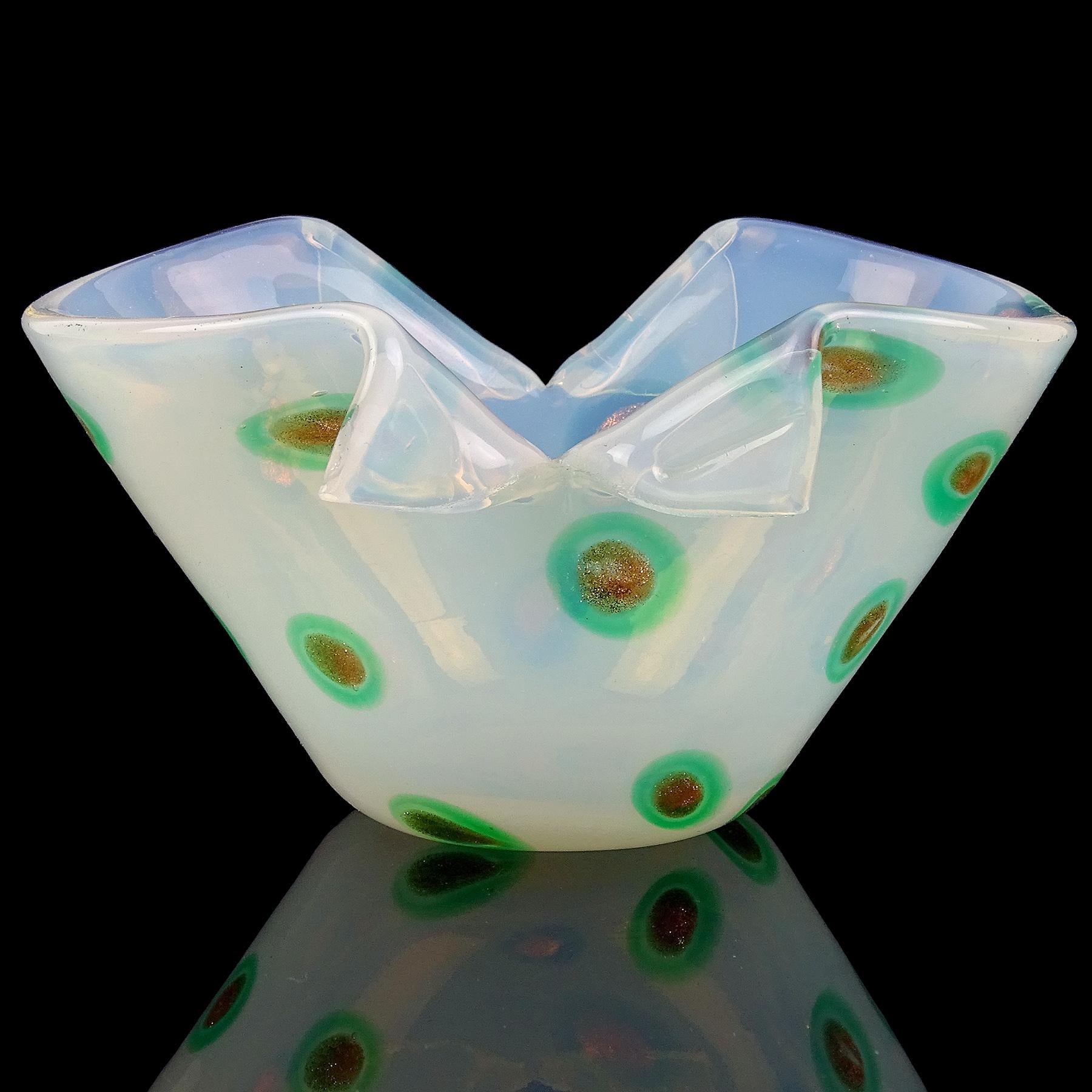 Beautiful vintage Murano hand blown white opal, with green and aventurine murrines Italian art glass scissor cut rim bowl. The piece is documented to the Fratelli Toso company. The bowl is made with thick white opalescent glass, with dot decoration