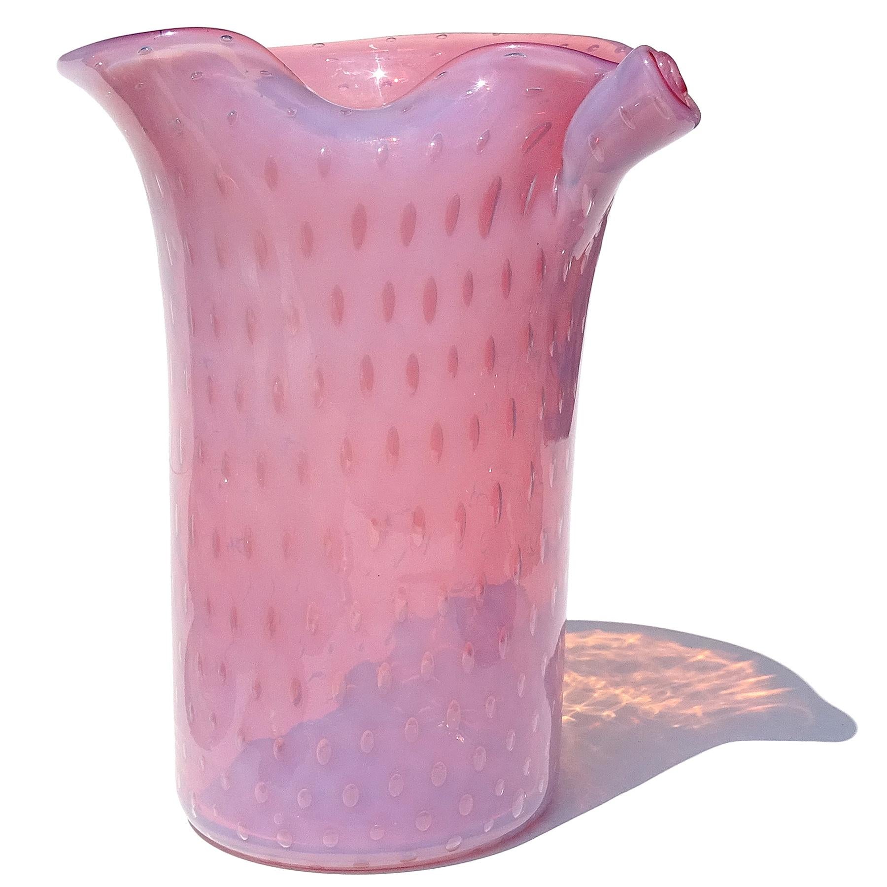Beautiful vintage Murano hand blown opalescent pink and controlled bubbles Italian art glass flower vase. Documented to the Fratelli Toso company. It still retains an original label. There is a slightly worn 