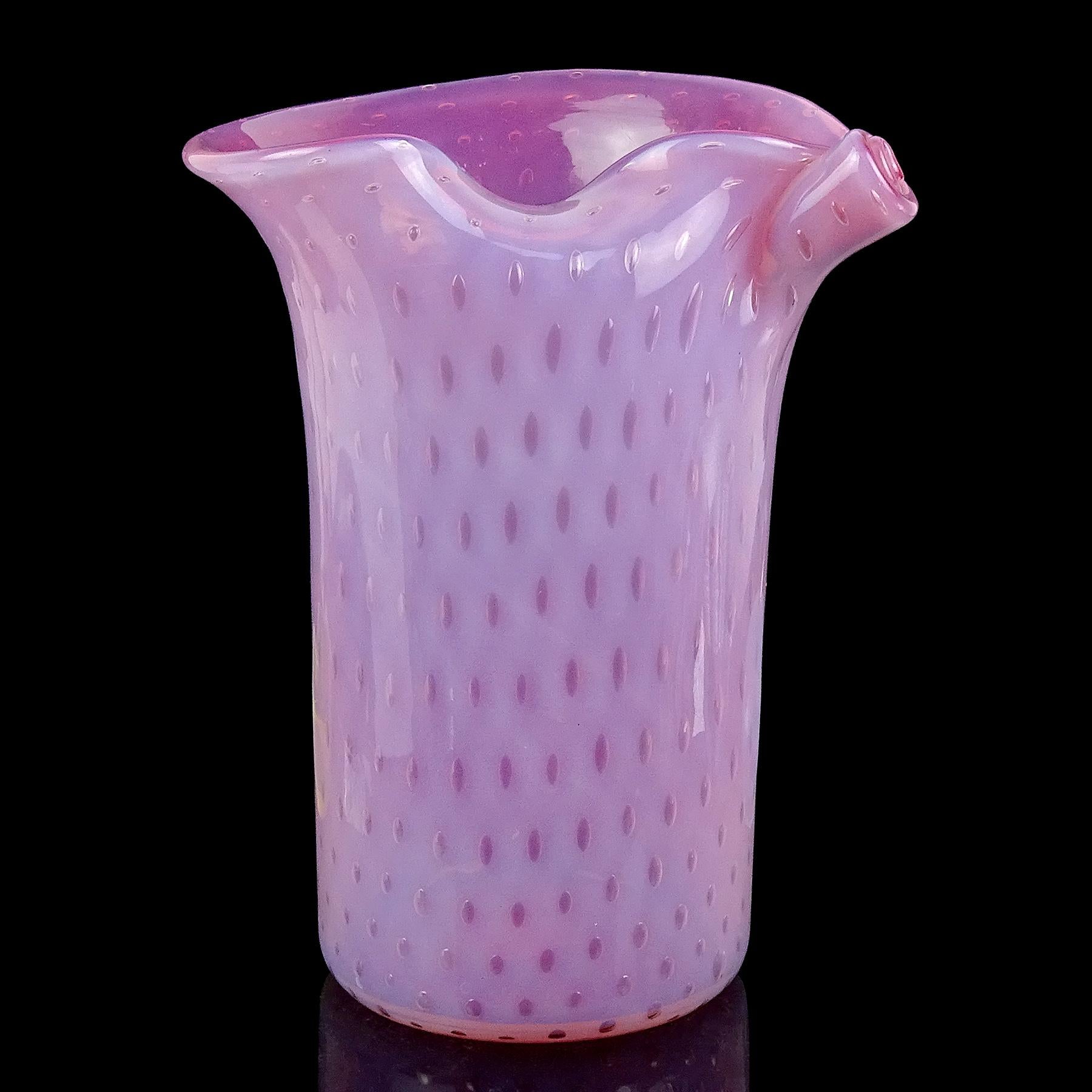 Beautiful vintage Murano hand blown opalescent pink and controlled bubbles Italian art glass flower vase. Documented to the Fratelli Toso company. It still retains an original label. There is a slightly worn 